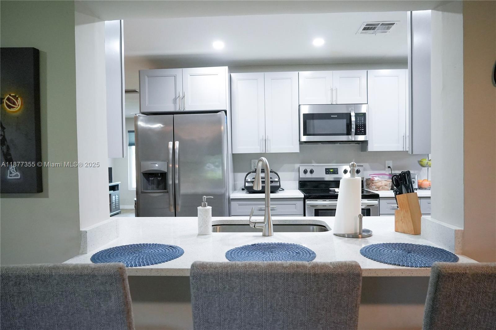Here is a great opportunity to own a fully remodeled home in The Mainlands of Tamarac. This is a 55+ section of The Mainlands and is ready for a new owner to love this home as much as the current owners do. Fully remodeled home including a beautiful kitchen with quartz countertops and stainless steel appliances, separate laundry room, impact windows and doors, custom closets and more. Do not miss this opportunity to own this amazing home in the sought after Mainlands of Tamarac.
