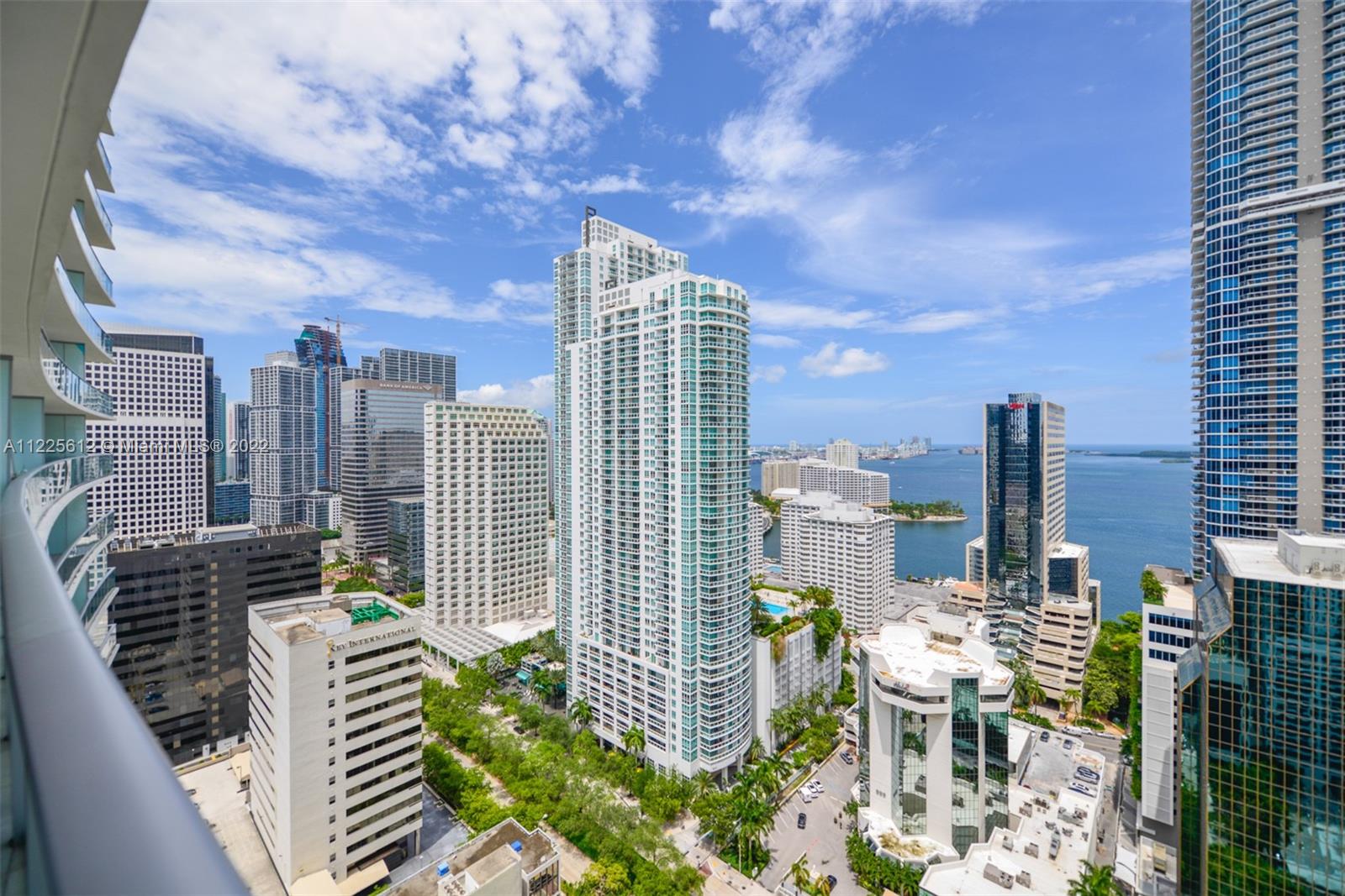 Premium HIGH-FLOOR unit with stunning bay and skyline views from walls of windows. Private balcony runs entire length of this skyhome with access from all rooms. Private elevator opens directly into this 2 Bedroom + enclosed den. This den includes a full bathroom so it is ideal for guests, nanny or extra bedroom. Work from Home or walk to the finance and tech offices outside your doorman lobby. 1010 Brickell is well-known for its amenities which include a rooftop pool, jacuzzi and bar. On the club level there is an indoor pool, basketball court, bowling, spa, outdoor running track, gym, children’s playroom and more. It is in the heart of Brickell within walking distance to Mary Brickell Village and Brickell City Centre.