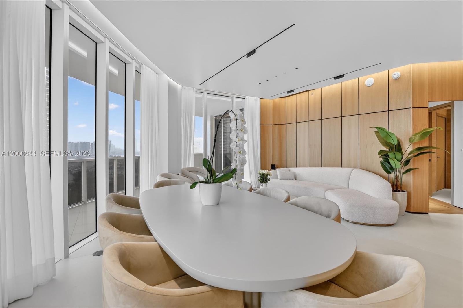 Step into a state-of-the-art, fully reimagined Bellini residence on Williams Island. This luxurious apartment showcases exquisite 6x6 porcelain limestone floors and custom parquet-style wood floors in the bedrooms. Every inch exudes sophistication with Miele appliances, Sub-Zero refrigeration, wine cooler, and built-in coffee maker. The den is adorned with a stunning book-matched backsplash, while backlit mirrors, linear diffusers, and elegant custom shades set the ambiance. Curved, magazine-worthy wall panels make a bold statement. The quartz kitchen, with a full backsplash and bar counter, is perfect for entertaining. High ceilings, a private elevator, and designer soffits with custom lighting create a grand feel. With 3 bedrooms plus maid’s quarters and a den, totaling 3.5 baths, this home offers ample space. The primary bath features travertine, backlit niches, an oversized shower, and a freestanding tub. Impact glass, custom closets with backlighting, tinted glass, and panoramic views complete this one-of-a-kind home. Enjoy The Williams Island Lifestyle With World-Class Amenities Including 14 Tennis Courts, 4 Pickleball Courts, 2 Padel Courts, 3 Restaurants, A State-Of-The-Art Spa, Marina, Walk/Jog Path, Kids Playground, Basketball Court, Soccer Field, Putting Green, Courtesy Bus, Plus A Gourmet Sundry Coffee & Gelato Shop And Much More !