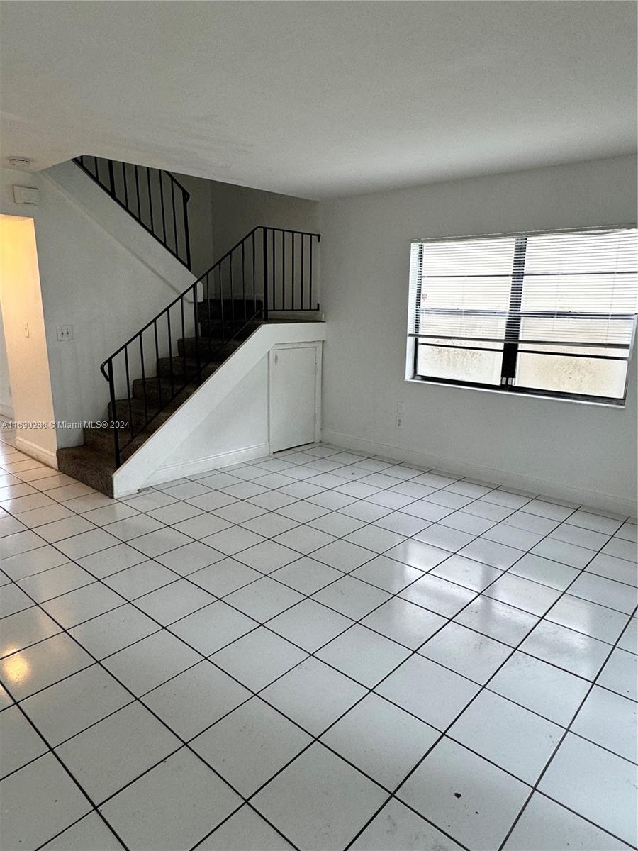 Come see this 2 bedroom 1 and half bathroom townhouse condo in the Century Garden neighborhood of Lauderhill. This home features over 1,000 sq. ft. of living space in a split level floor plan with 2 ample bedrooms and a full bathroom upstairs and a convenient half bathroom downstairs (both bathrooms have been remodeled), beautifully updated kitchen with plenty of wood cabinetry, central ac, washer and dryer in unit, tile flooring downs stairs and newly updated flooring upstairs. Outside, enjoy the fenced in patio. Conveniently located just minutes from major highways, shopping and dining. 650 minimum credit score requirement per association.