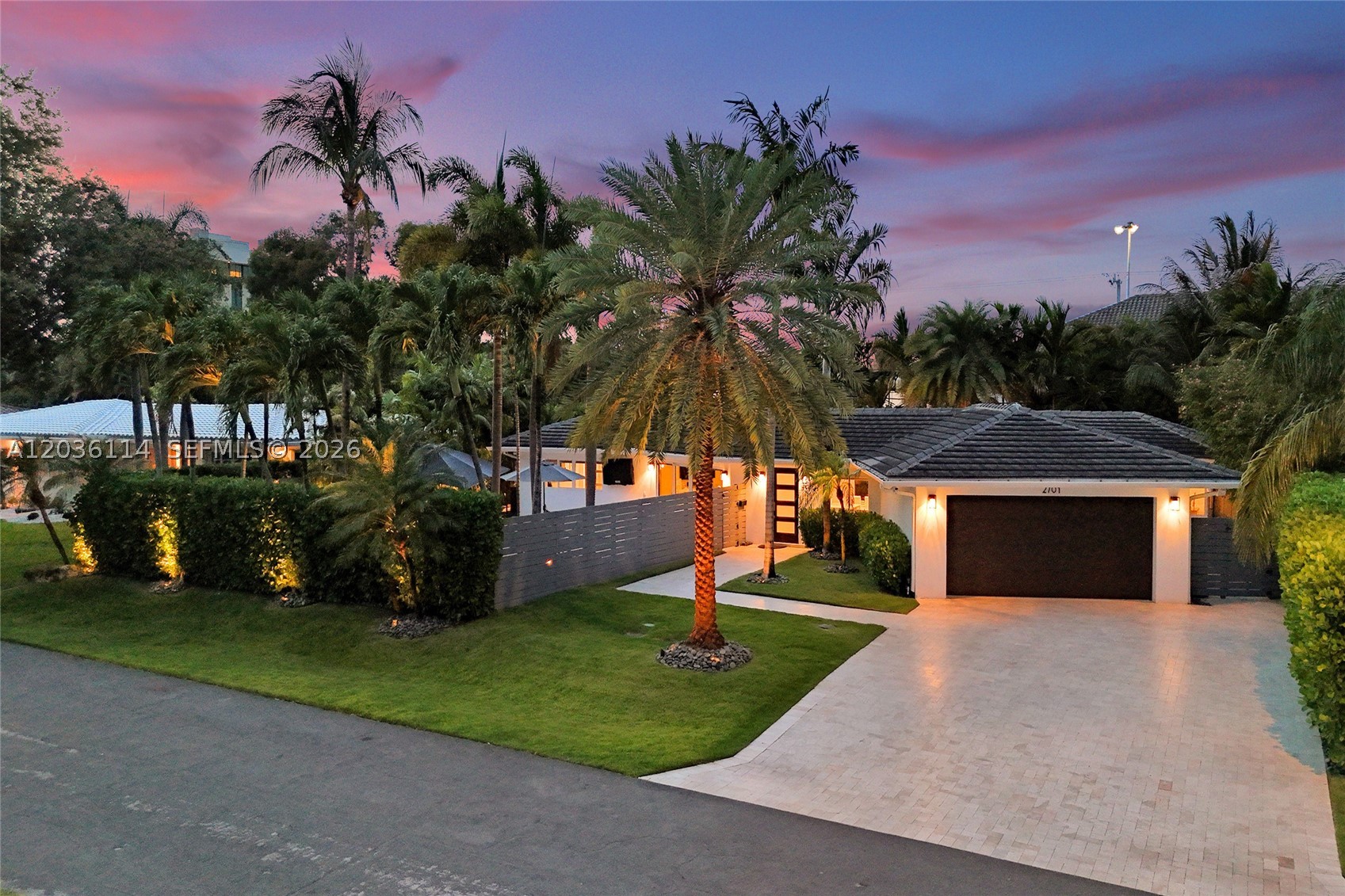 IF YOU LIKE THIS HOME DURING THE DAY, YOU'LL LOVE IT AT NIGHT! A private Coral Ridge retreat designed for effortless entertaining, with two distinct resort-style outdoor experiences. Situated on a beautifully landscaped oversized lot, this meticulously upgraded 4-bedroom, 3-bath home features 2,851 SF of total living space and over $200,000 in owner improvements inside and out. Designed for the ultimate Florida lifestyle, one outdoor area showcases a spectacular 700+ SF covered StruXure Pergola X pavilion featuring motorized rain-shield louvers, integrated lighting, ceiling fans, above a comfortable gathering space. The second is a resort-style entertainment area centered around the heated saltwater pool w/ mood lighting, outdoor summer kitchen, and putting green, designed for hours of fun for family and friends. Inside, enjoy smart-home technology including Sonos interior and exterior audio, Lutron lighting, automated shades, and a Nest security system. Additional upgrades include a Generac 22kW generator with 1,000-gallon buried tank, Rinnai gas water heater, custom closets, epoxy climate-controlled garage, extensive landscape uplighting, putting green, and over 3,000 SF of travertine pavers. Completed renovations to primary closet and all bathrooms by Wolfe Construction. Located in highly sought-after lush Coral Ridge, with proximity to Coral Ridge Country Club, Bayview School District, Galleria Mall, and Fort Lauderdale Beach.