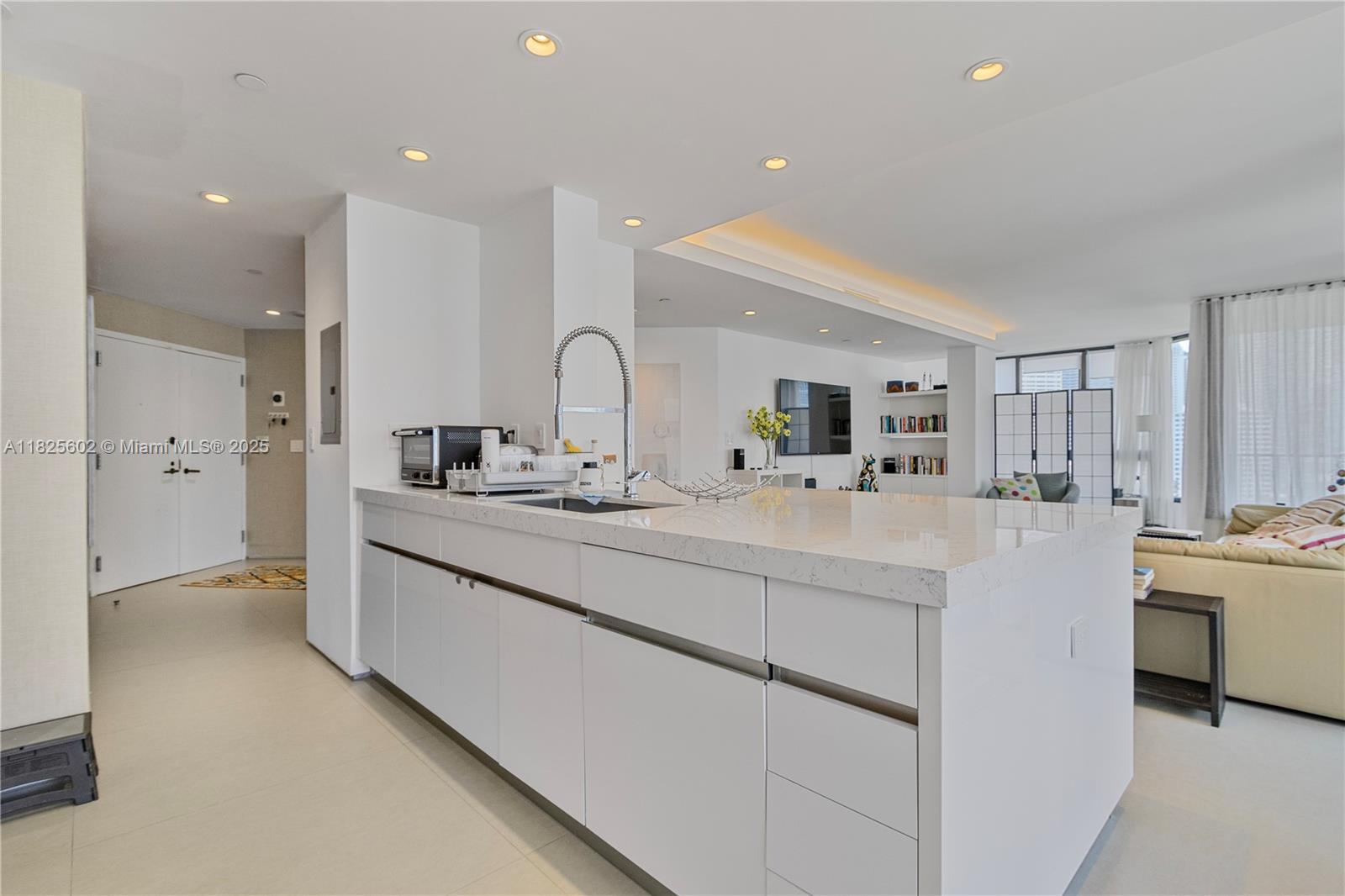 Exceptional 3BD/3BA in exclusive Brickell Key — fully renovated with exquisite taste and attention to detail. This bright and spacious residence features impact windows, high-quality finishes, and abundant natural light throughout. The thoughtfully designed layout includes a dream kitchen perfect for a family, a generous open-concept living space, a large laundry room, and a separate pantry. Additional highlights include semi private access elevator, 1 assigned parking space,, storage unit, and access to top-tier amenities at Brickell Key One: 24-hour security, bayfront walking path, resort-style pool, jacuzzi, tennis and basketball courts, fitness center, BBQ area, party room, kids’ playroom, pet area, and valet service.