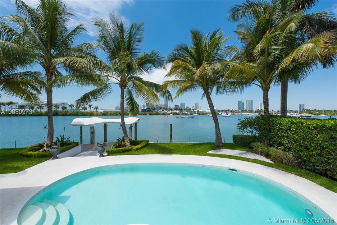 Waterfront Gem on Gated Palm Island. Stunning city views & quality finishes w/ many thought out details. Modern home, Open & Bright. 5bd/4bth, Large Master Suite, custom closets. Theater room w/ private Wine storage. Chef's kitchen, Italian Cabinets, Subzero & Gaggenau appliances, Industrial hood, Prep sink, Deep fryer, Conventional & Steam Oven, Teppanyaki grill & Wine Station. 80' waterfrontage, heated pool, Outdoor Kitchen, huge terrace. Savant sysytem, Bang & Olufson Audio. Solar Panels.