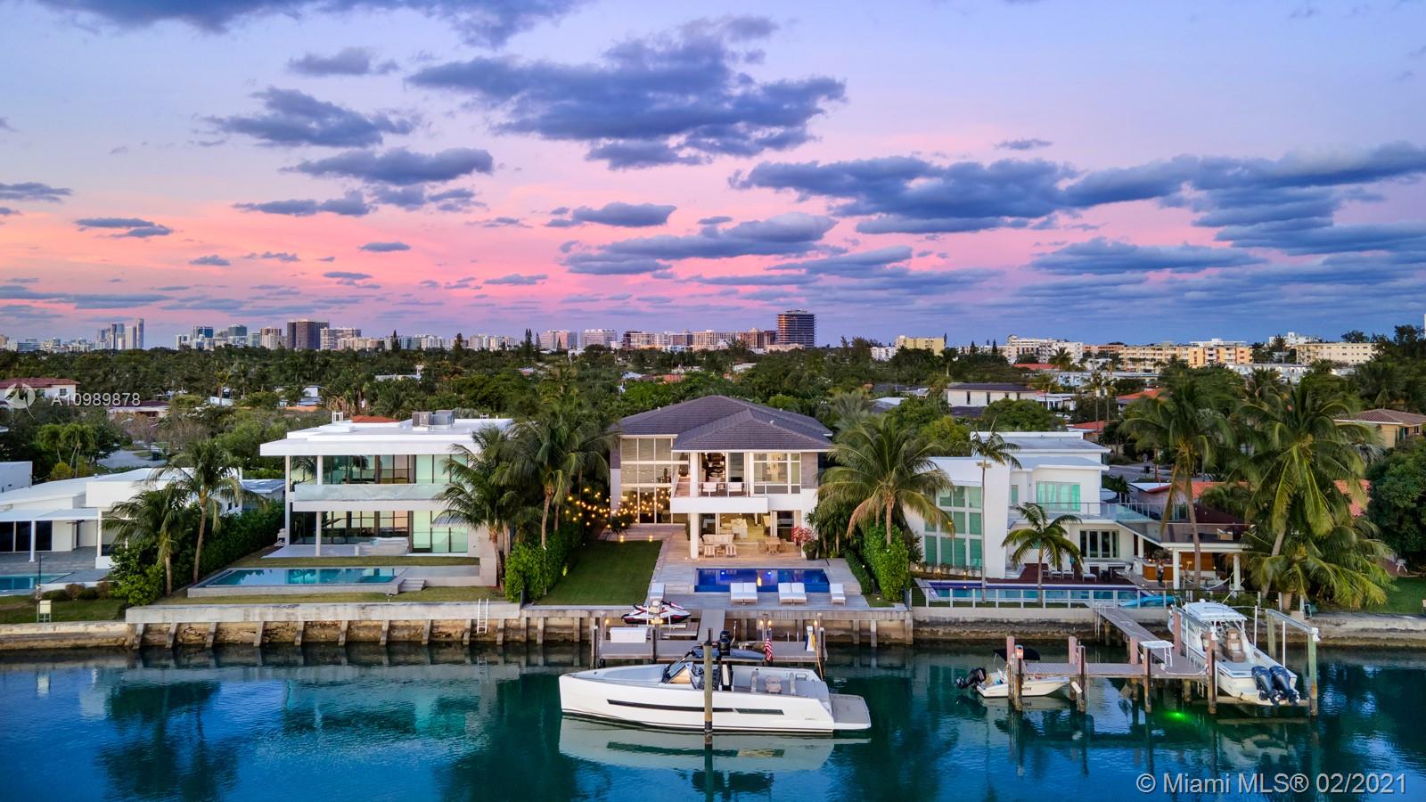 This stunning modern villa with 7,451 SF of construction and 5,600 SF under AC is Biscayne Point's most desirable listing. The south facing, 11,250 SF lot offers a sun exposed pool all day with 75 FT on Biscayne Bay. Large manicured garden and full outdoor kitchen are perfect for entertaining your friends and family. Fully integrated smart home powered by Savant. Italian kitchen with Sub-Zero/ WOLF appliances. Service quarters with bedroom / bathroom. Five minutes from Bal Harbour Shops and 10 minutes from the heart of South Beach.
