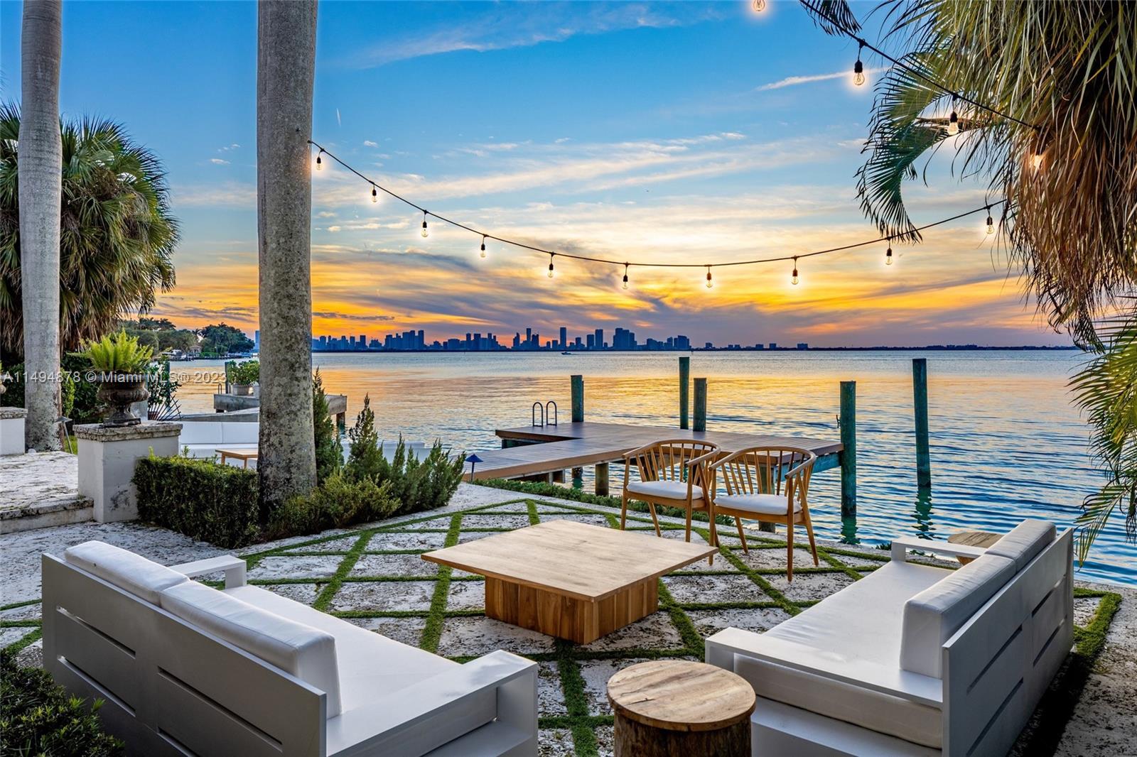 Enjoy living in this exquisite waterfront estate on prestigious N Bay Rd. A picturesque courtyard greets you as you enter this captivating residence. Large stained-glass windows bring in an abundance of natural light with high ceilings and sparkling views of the bay. Exuding charm with its classic architectural elements, surrounded by the serenity of the water's edge the home boasts 75 ft of prime waterfrontage, beautiful stone and wood floors, an architecturally stunning Victorian spiral staircase with soaring ceilings and a spacious primary suite overlooking the water. The outdoors feature a plunge pool and elegant loggia, the perfect setting for Miami’s best sunsets. A separate guest house with two bedrooms overlooks the stunning courtyard.