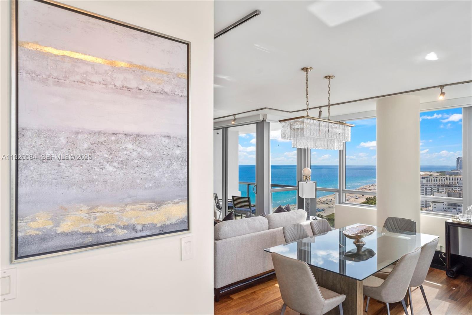 NEW ON MARKET! RARE CORNER 2 BR SKY MASTERPIECE WITH VIEWS THAT TAKE YOUR BREATHE AWAY! Setai Unit 3202 isn't just a residence, it's where Miami feels infinite.  This rare corner oceanfront 2 BR sky-level masterpiece is where every sunrise feels private and every sunset belongs only to you. Nightly, weekly, monthly rentals allowed for maximum income & enjoyment. This reimagined corner residence floats above Billionaire’s Beach with RARE cinematic 280 degree panoramic views - ocean, coastline, South Beach, Biscayne Bay and Miami skyline panoramas. Wrapped in floor-ceiling glass, every hour paints a different color across the horizon. Upgraded with stunning new furnishings & artwork - every detail has been custom curated for maximum enjoyment including sleek bar area and work station. Newly polished teak floors & doors, custom acoustic wood paneling, sound system, electric somfy shades, upgraded baths, new furnishings, curated art pieces and gallery-style lighting elevate every moment.  Every inch maximized, every view unforgettable. Setai’s award winning service & elite amenities include 3 pools, private beach service, spa, and 3 world-renowned dining options.  The Setai is a Forbes Travel Guide 5 Star destination.  Unit 3202 delivered turn-key including artwork. Ideal for both lifestyle enjoyment & income potential. DO NOT MISS THIS OPPORTUNITY TO OWN AN ELITE ONE OF A KIND SKY HOME.