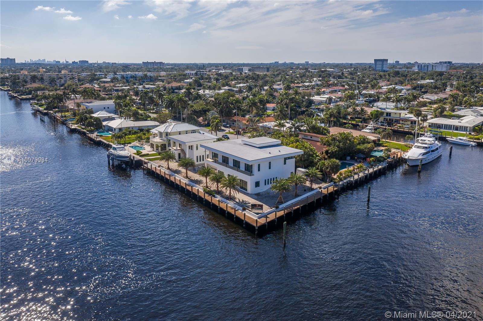 Another Luxurious Brand New Construction Estate Designed By Karam Brothers. This magnificent point lot estate is conveniently situated on one of the wider canals in the area and only minutes to Hillsboro inlet. 
ULTIMATE Yachter's dream with 267 feet of water frontage offering breathtaking views and all the benefits of waterfront living. The contemporary architecture and layout design offer a stunning main house featuring top-of-the-line upgrades and finishing touches and a separate carriage house perfect for your guests, captain or private gym. Call today for details and to schedule your private tour.