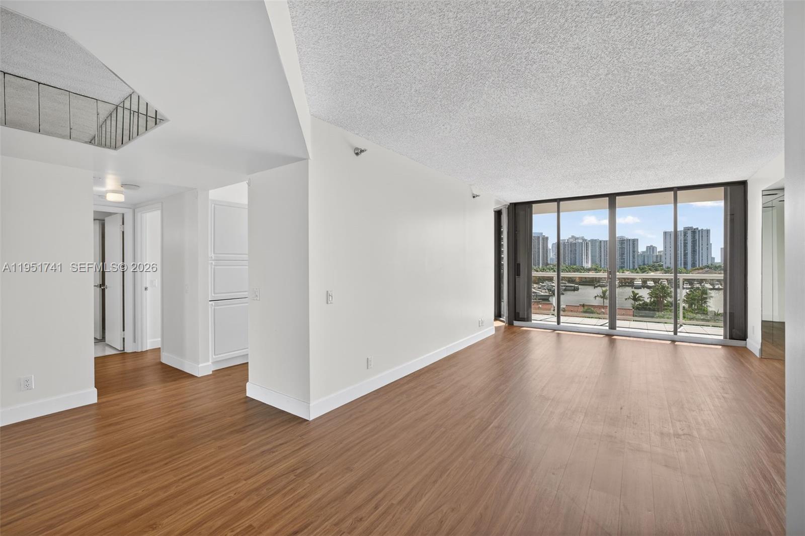 WOW! ENTER THIS FABULOUS RESIDENCE IN HARBORSIDE IN THE WATERWAYS AND IMMEDIATELY AND THROUGHT OUT SEE SPECTACULAR VIEWS OF THE WATER, MARINA & CITY SKYLINE.  THIS IS A COVETED SPACIOUS SPLIT BEDROOM. FLOOR PLAN TO CEILING WINDOWS AND A LARGE WRAP AROUND TERRACE. APARTMENT FEATURES: SPECTACULAR, UNOBSTRUCTED MARINA VIEWS, LARGE,BRIGHT RESIDENCE WITH EXCELLENT NATURAL LIGHT YEAR-ROUND, FLOOR-TO-CEILING WINDOWS THROUGHOUT HOME, BALCONY ACCESS FROM EVERY ROOM, SPACIOUS TILED WRAPAROUND BALCONY WITH TRANSPARENT GLASS RAILINGS, TWO GENEROUSLY SIZED BEDROOMS WITH JACUZZI/SOAKING TUB, SEPARATE GLASS-ENCLOSED SHOWERS, DOUBLE SINKS IN THE PRIMARY  BATHROOM, KITCHEN WIOTH AMPLE SPACE FOR CASUAL DINING, WAL-IN CLOSETS,HURRICANE SHUTTERS ON ALL WINDOWS, TWO COVERED ASSIGNED PARKING SPACES, AIR-CONDITIONED STORAGE ROOM. Marina Views Throughout from Floor to Ceiling Windows and Large Wrap Around Terrace! Beautiful Full Service Building W/ 24hr Security, Concierge, Upgraded Gym, BBQ Grills, Lounge, 2 Heated Pools, Jacuzzis, Saunas, Basketball, Pickle Ball + Tennis, And So Much More!
