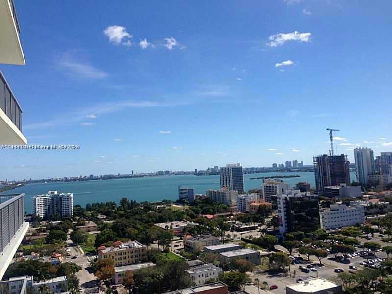 Live at the heart of Midtown Miami.Don't miss out on the premier residence in trendy Midtown Miami with expansive views of Biscayne Bay and the city skyline. Exposed concrete ceilings give this unique home an urban vibe, while the floor-to-ceiling windows and doors allow plenty of light. Beautiful flooring, an open kitchen, and stainless steel appliances are just some of the outstanding features of this property. 4Midtown residents enjoy recently renovated common areas, including a stylish lobby w/24-hour security, an expansive fitness center, a resort-style pool w/ hot tub, steam room, sauna, BBQ areas, and a business center. Enjoy the very best of Miami, with Midtown shops, restaurants, & lounges and within walking distance of the Design District & the Wynwood Arts District
