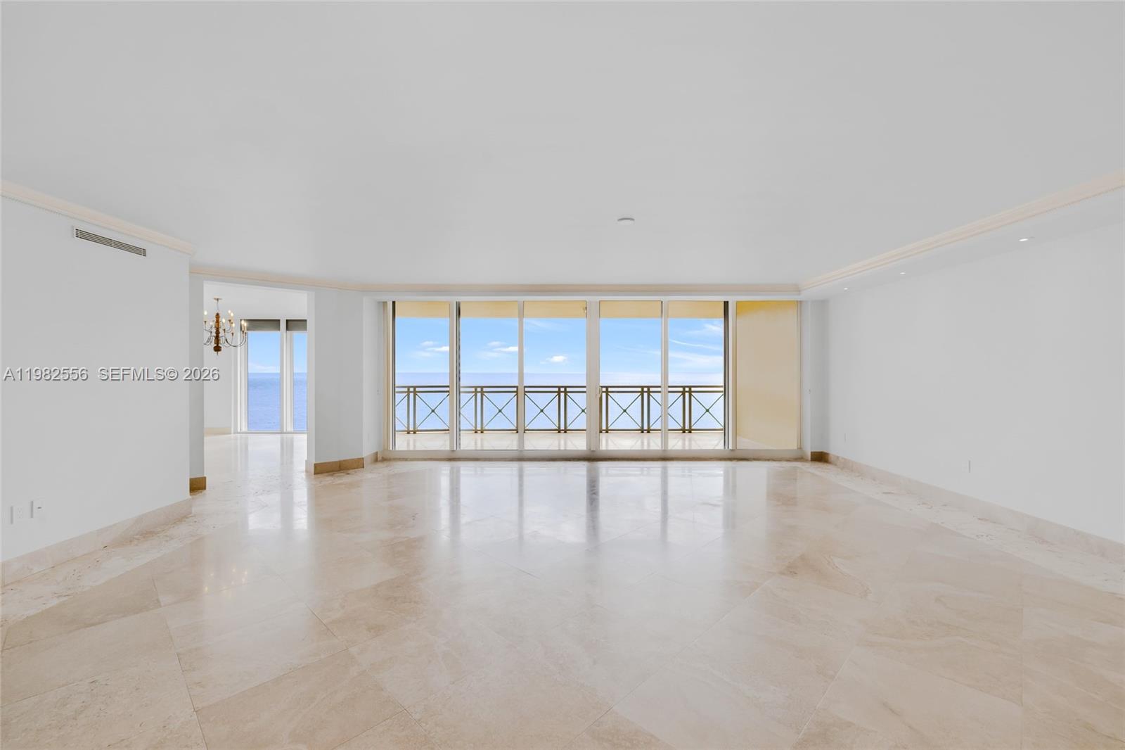 Rarely available, this exceptional residence at Grand Bay offers approximately 3,950 sq. ft. of interior living space plus three expansive balconies, creating a spectacular indoor–outdoor lifestyle with breathtaking, unobstructed ocean views. From the moment you enter, the residence captures the beauty of the Atlantic with expansive vistas and the soothing sound of waves crashing along the shoreline, offering a truly serene coastal living experience.