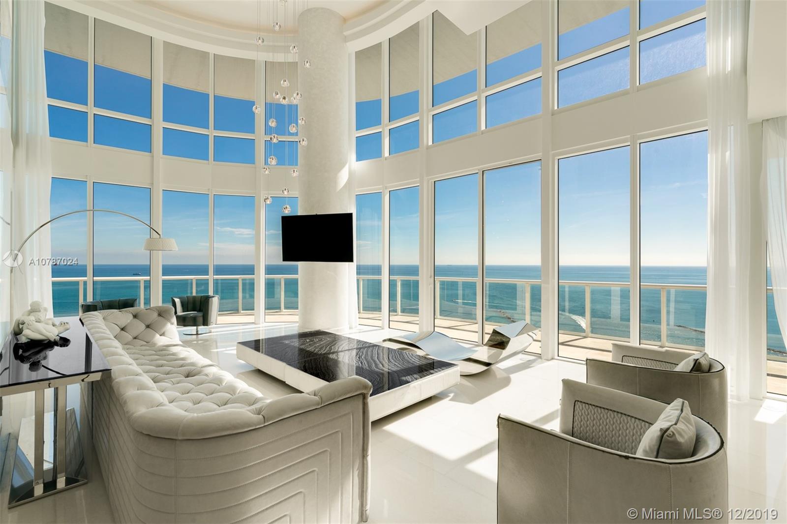 Double height ceilings and breathtaking views all from this rare two story fully renovated 3 bed plus maids quarters residence at Continuum. Boasting 20 FT floor to ceiling glass windows, backlit columns clad in Onyx & Blue Agate accents, marble flooring throughout, a glass staircase, two master suites, staff quarters, an open kitchen with SubZero, Miele & Wolf appliances, custom 360 degree show closet and unparalleled panoramic views of South Beach & Fisher Island. Continuum is a resort style residence set in a beautiful and lush landscaped 12 acre property with 1,000 linear feet of ocean frontage, full beach service, a gourmet restaurant on site, two lagoon style pools, lap pool, three clay tennis courts, and a 20,000 SF state of the art fitness center and spa.