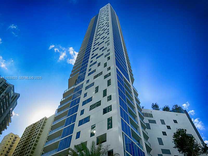 Immediate income generating opportunity at Brickell House. This modern residence features white porcelain flooring throughout, floor-to-ceiling impact windows, and a European-style gourmet kitchen with premium stainless steel appliances and quartz countertops. The spacious bathroom offers a double vanity and soaking tub. Please Note: This unit is situated on a lower floor with an obstructed view directly facing the adjacent building's parking garage; priced accordingly. Building amenities include a rooftop pool with panoramic skyline views, a separate lap pool, luxury fitness center, spa, concierge, and valet. Walk to Mary Brickell Village, Brickell City Centre, and top-tier dining.