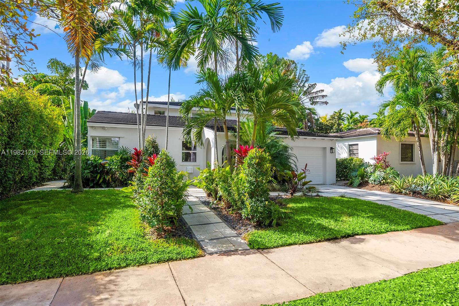 Tucked along a quiet, no-through street in the heart of Coral Gables, this beautifully renovated 4-bedroom, 3.5-bath residence offers a rare blend of privacy, charm, and thoughtful design. Sunlit living and dining rooms welcome you in with warm hardwood floors and plantation shutters, creating inviting spaces for both elegant entertaining and relaxed gatherings.
At the heart of the home, the kitchen and family room flow effortlessly together for everyday living. The kitchen features sleek Lioher cabinetry, Bosch appliances, and a cozy breakfast nook that overlooks the garden. French doors open to a tranquil terrace surrounded by lush greenery, an ideal setting for morning coffee & alfresco dinners. 
Upstairs, the spacious primary suite offers a peaceful retreat with a walk-in closet & a beautifully appointed bath, while an additional ensuite bedroom provides comfort & privacy. Downstairs, two additional bedrooms with a shared bath offer flexibility for visiting family, a home office, or growing households.
Thoughtfully upgraded throughout, the home includes impact windows & doors and a 2017 roof. A generous laundry room with sink & storage, side entry access, a one-car garage, and an outdoor Bose sound system add everyday ease.
Just blocks from Plaza Coral Gables, the Shops at Merrick Park, and Miracle Mile, this home places you moments from some of the City Beautiful’s best dining, shopping, and cultural experiences.