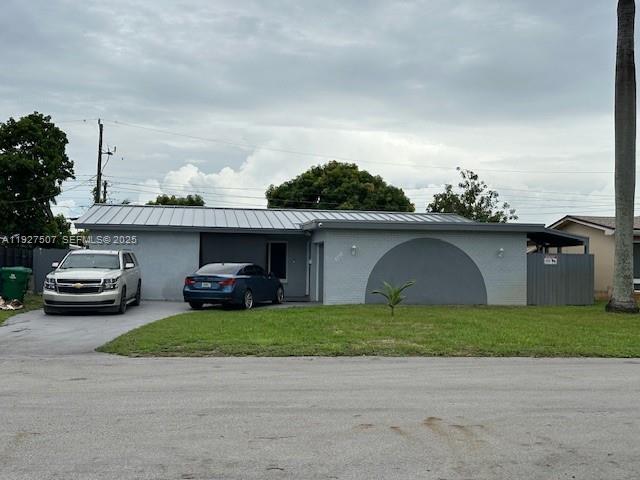 Updated 4BR/3BA home with pool, impact windows & doors, and metal roof. Features modern open layout, stylish kitchen, and spacious primary suite. Includes private in-law quarters with income-producing potential. Backyard oasis with pool and covered patio. Move-in ready and built to last!