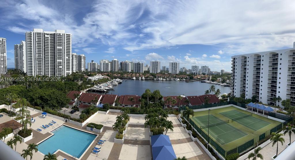 BREATHTAKING panoramic view of the beautiful Waterways Marina and beyond from every room in this large and bright unit with 2 bedrooms and 2 full bathrooms and a very spacious 1,430 SF (largest 2/2 in Harborside). Split floor plan with gorgeous marble floors, floor-to-ceiling windows, and oversized balcony. Full size washer and dryer inside unit. Assigned and covered parking space. This beautiful and elegant building is newly renovated and features incredible swimming pool, hot tub, sauna, tennis courts, gym, multi-purpose room, kids room, ample free guest parking and more. Large air-conditioned storage unit. 24-hour lobby concierge and security. Pet friendly building. Walk to marina, intracoastal, restaurants, grocery store, post office, high school. Minutes to beach, Aventura Mall, Gulfstream Racing & Casino, and close to everything!
