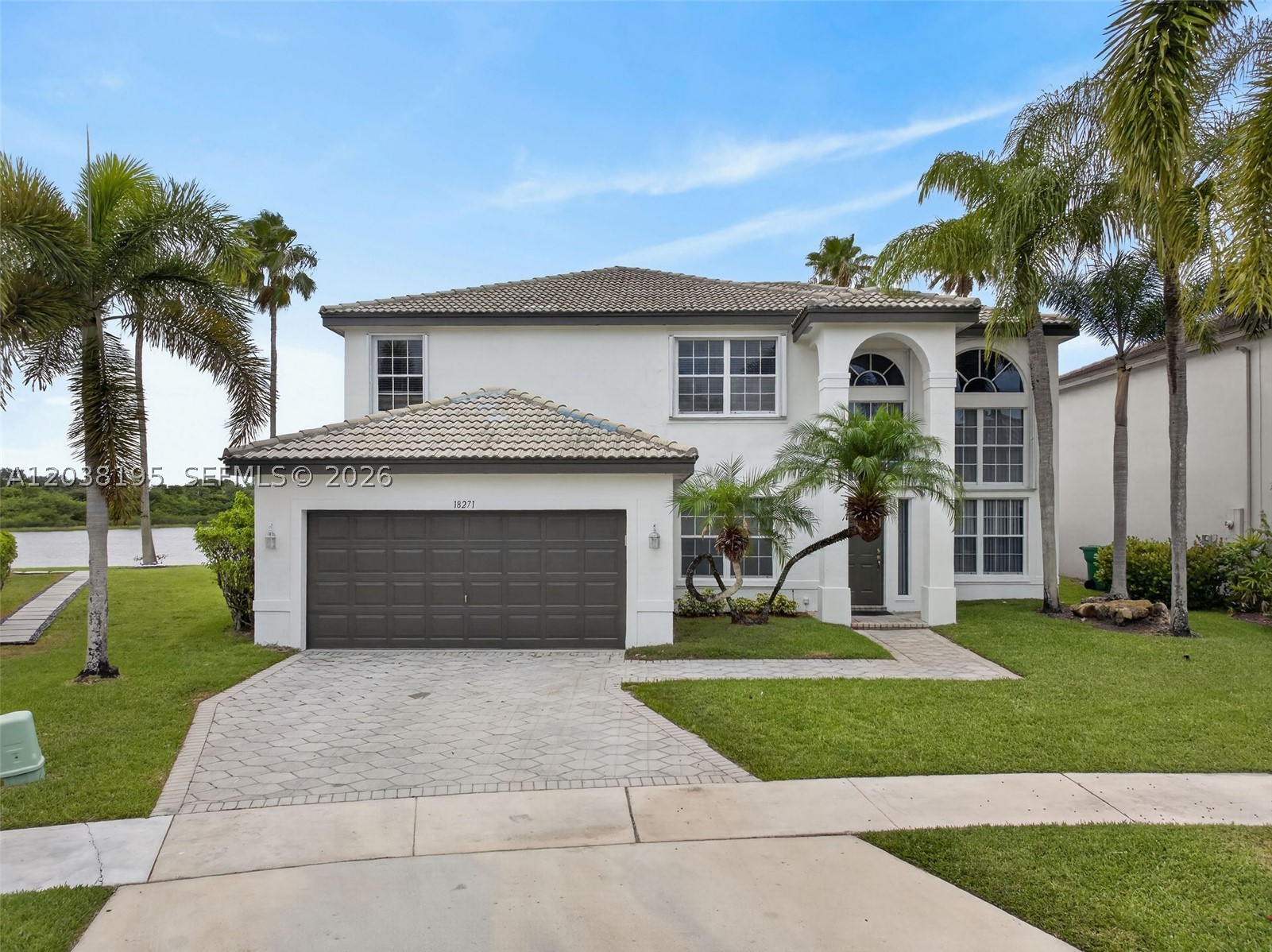 Gorgeous waterfront home in Pelican Cay, a gated subdivision at sought after Silver Lakes, waiting for the next lucky owners!. Enter this  Bright and airy home, with double height ceilings in living room area, and formal dining room overlooking the backyard and lake. Spacious kitchen with breakfast area and  large family room, ideal for entertaining. 1 bedroom and full bath downstairs, perfect for guests or In Laws. Lots of storage space in this model! On 2nd floor, a large master bedroom w/2 walk in closets, and 2 more bedrooms with full bathroom, plus an OPEN LOFT EASY TO CONVERT TO 5TH BEDROOM, perfect for kids playroom, home office,  arts and crafts area, etc. Freshly painted, both interior and exterior. Accordion shutters on 2nd floor windows for your convenience, panels on 1st floor windows.  Large Pie shape lot gives you the possibility of building your dream resort style backyard. Easy to show, read Brokers Remarks. ATTENTION: 5TH TO 14TH PICTURES  ARE VIRTUALLY STAGED FOR PURPOSES OF SENSE OF DIMENTION OF DIFFERENT ROOMS IN THE PROPERTY.