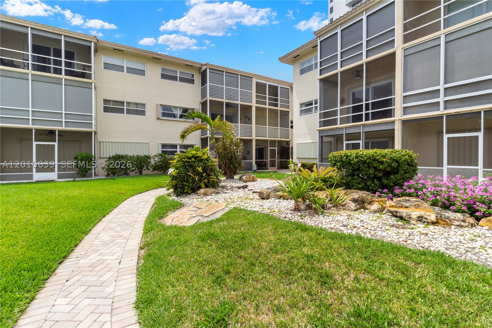 Experience waterfront luxury in this stunning ground-floor apartment, nestled in the coveted Coastal Waterways Coop.  Enjoy your beautiful paradise from your private screened-in porch, perfect for relaxing mornings or alfresco dining. The bright, airy layout features a revamped kitchen, plenty of storage, and an open-concept living area that flows seamlessly into the spacious bedroom with en-suite bath.This gated boutique community offers a tranquil oasis, just steps from Hallandale Beach's best amenities. Stroll to the beach, explore top-rated shops and eateries, or take advantage of nearby attractions like Gulfstream Park and Aventura Mall. With easy access to Miami and Fort Lauderdale airports, this waterfront retreat is perfect for full-time living or a dream vacation home. Don't miss this rare opportunity to own a slice of paradise!