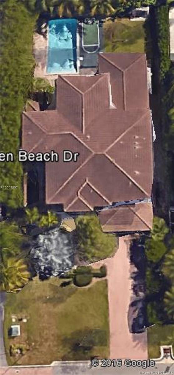Stunning six bedroom Classic Home. High ceilings. Marble & wood floors. Stainless steel and granite kitchen. Master bedroom on first floor with access to beautiful pool deck. Impact doors & windows. Separate maids quarters. Shows like a model home.