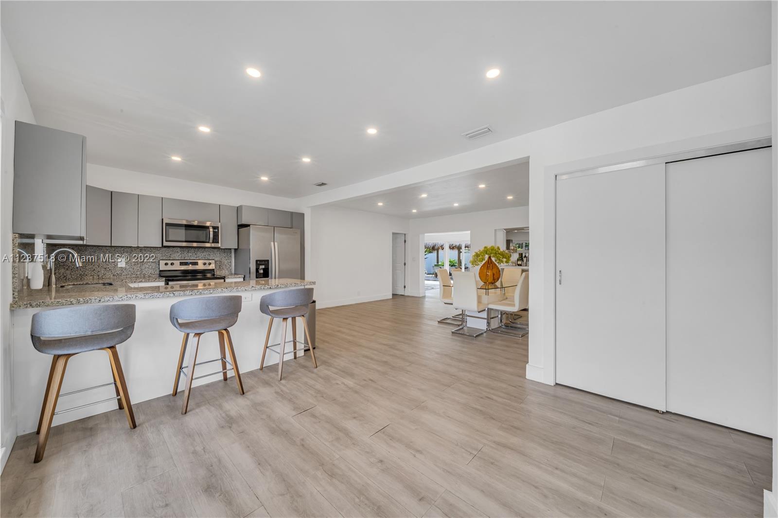 Come and see this fully remodeled Single Family Corner Home. It's located in one of the most desirable neighborhoods, Flamingo Park. The home features 4 bedrooms and 2 bathrooms. In 2019 the property was redone to include a modern kitchen with stainless steel appliances, remodeled bathrooms, newer A/C, wood floors throughout the house, and new electric/plumbing. New impact windows and doors were installed in December 2020. Family room has floor-to-ceiling impact doors that give an abundance of light to the entire house from the moment you open the front door. A new TIKI hut was recently added to fit a table for 8 and a pool table for entertaining. The property is fully fenced with a side door that fits a boat, a motorhome and plenty of space for a pool and/or addition.