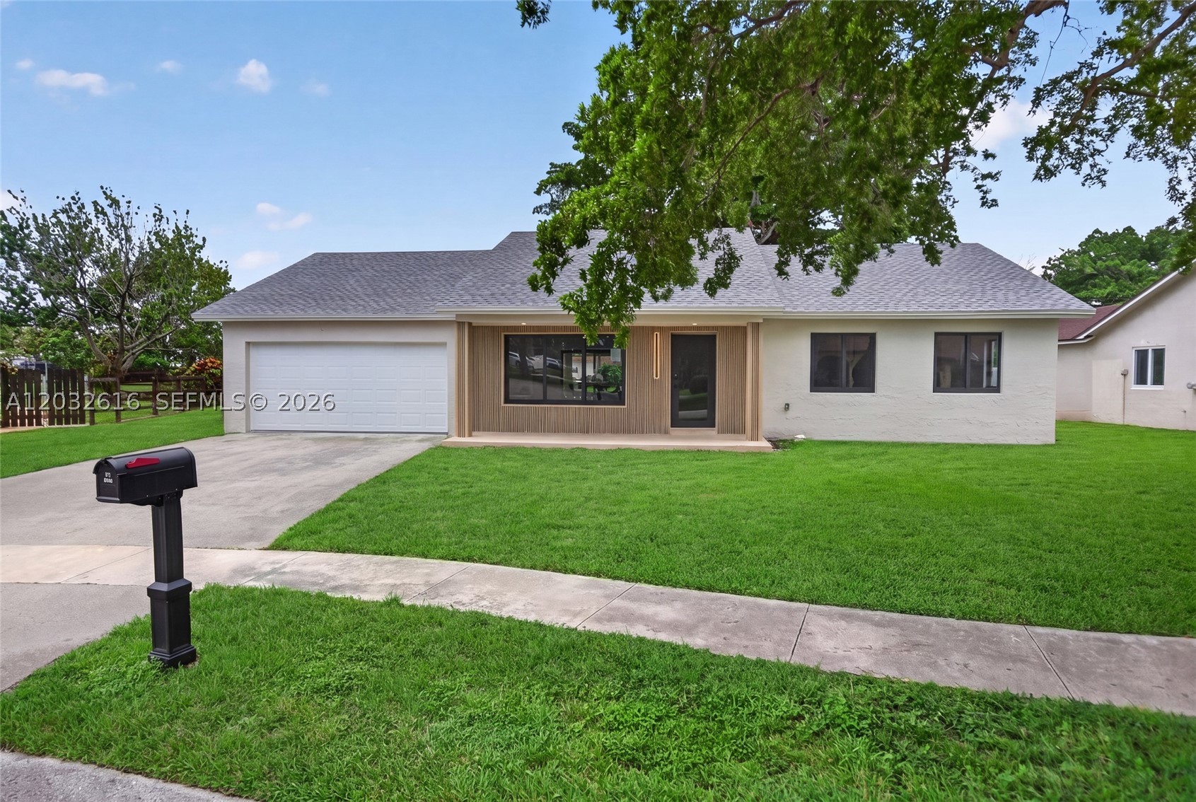 This exceptional LAKEFRONT home was extensively rebuilt and reimagined in 2026 with virtually every major component replaced. Taken down to the studs and renovated with quality craftsmanship and attention to detail with a modern flare.  This 3-bedroom, 2-bath home sits on an oversized 9,700+ sq. ft. lot with peaceful lake views, no rear neighbor, and NO HOA. Fully renovated with a modern 2026 design and completed with full architectural blueprints and approved renovation permits, Renovation features include a new 2026 ROOF, all IMPACT WINDOWS AND DOORS, NEW A/C, tankless water heater, updated electrical, updated plumbing, large-format porcelain tile throughout, new interior doors, fresh paint, LED lighting, and a sleek modern kitchen with new cabinetry, quartz countertops, and stainless-steel appliances. Both bathrooms have been completely redesigned with high-end contemporary finishes.  The large backyard offers excellent outdoor living potential with coved lanai and room for a pool.  Paver driveway under construction. Turnkey, modern, and rare for the area—this home delivers the feel of new construction in an established Cooper City neighborhood. All permitted and survey is provided.