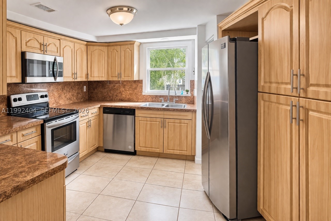Beautiful lakefront 3-bedroom, 3-bathroom townhouse—Experience the perfect blend of comfort, style, and convenience in this rare find with a full bathroom for each bedroom!
This thoughtfully designed home features an upgraded kitchen and modernized bathrooms, offering both elegance and functionality. The first floor welcomes you with a bright and open living and dining area, a convenient guest bedroom with full bath, laundry area, and sleek ceramic tile flooring throughout.
Upstairs, you’ll find a spacious primary suite with a private bathroom, generous walk-in closets, along with a second bedroom and a third full bath—perfect for family or guests.
Ideally located in a gated community, this home is just minutes from shopping, dining, top-rated schools, and the Florida Turnpike—making daily living effortless.
Enjoy peaceful lake views, modern upgrades, and an unbeatable location. Fee simple lakefront townhouse with low HOA ($169/month)—ideal for end-users or investors. This is Florida living at its best!
