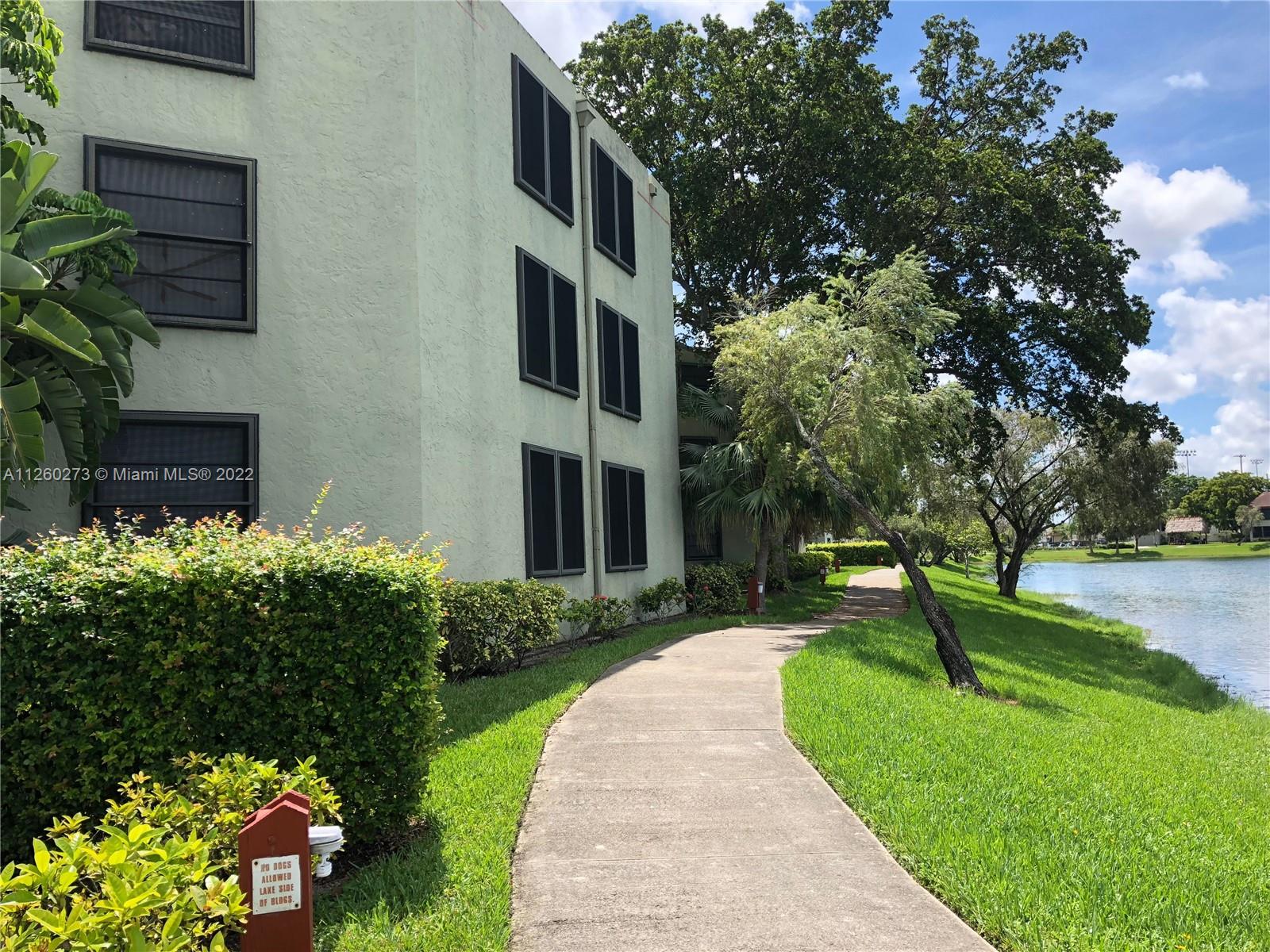 ATTENTION INVESTORS! RENTED UNIT! NEW STAINLESS STEEL APPLIANCES! 2 Bedroom/2 full bathroom ground floor unit with screened porch, tile floors throughout, long term tenant in place paying $1,560 until May 2023. The community recently went though a complete update, new painted buildings, lakes, pools, management on site. Parking. Great location.