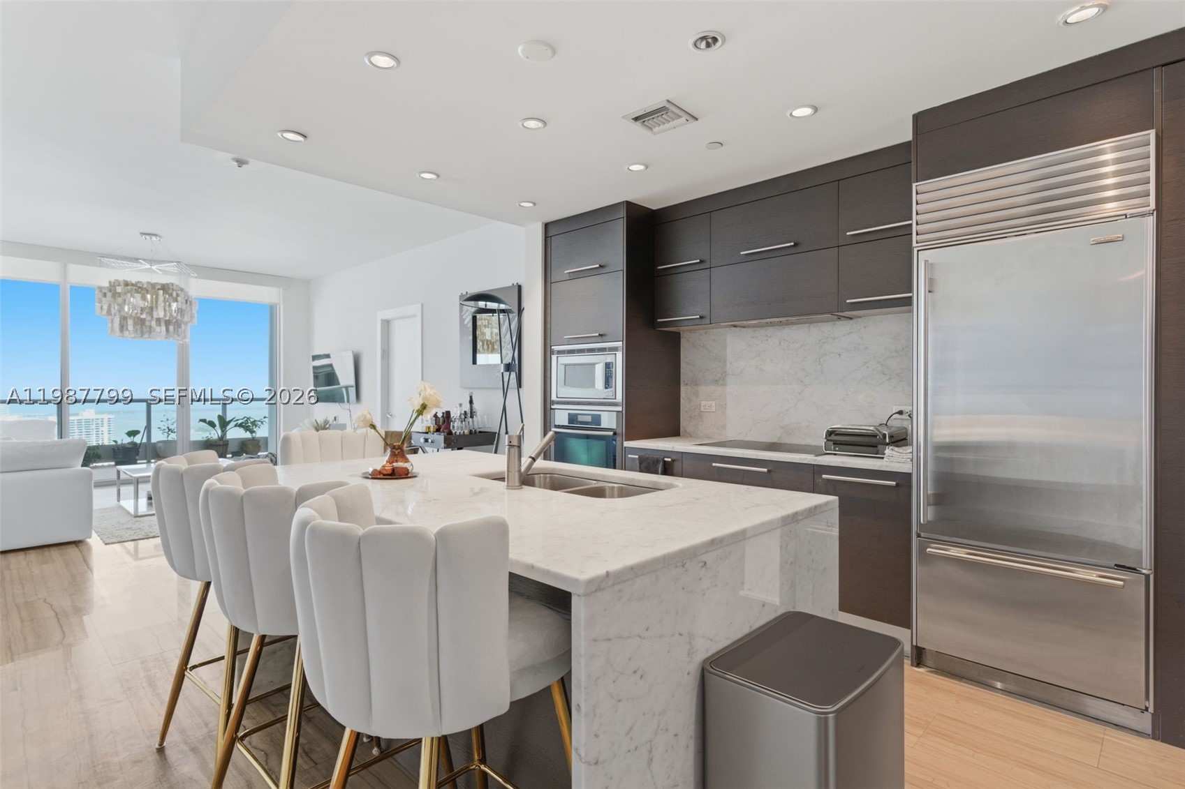 Well-positioned 2-bedroom + den, 3-bath residence at 900 Biscayne Bay, neighboring Miami’s most iconic architecture, including 1000 Museum.

This 1,576 SF residence offers a private elevator entry and a thoughtfully designed layout that balances open living with defined spaces. The nearly 400 SF terrace extends the living area outdoors, showcasing unobstructed views of Biscayne Bay and the evolving Downtown skyline.

Interiors feature marble flooring in the main areas, wood-grain porcelain in the bedrooms, custom-built closets, and a sleek European-style kitchen with marble countertops, Italian cabinetry, and premium Sub-Zero and Miele appliances. Bathrooms have been upgraded with clean, modern finishes, complementing the residence’s overall understated sophistication.

Set within a full-service luxury building, residents enjoy 24-hour concierge, valet, security, fitness center, spa, theater, and resort-style pool deck.

A well-balanced residence offering privacy, functionality, and a front-row position to Miami’s most dynamic urban waterfront.