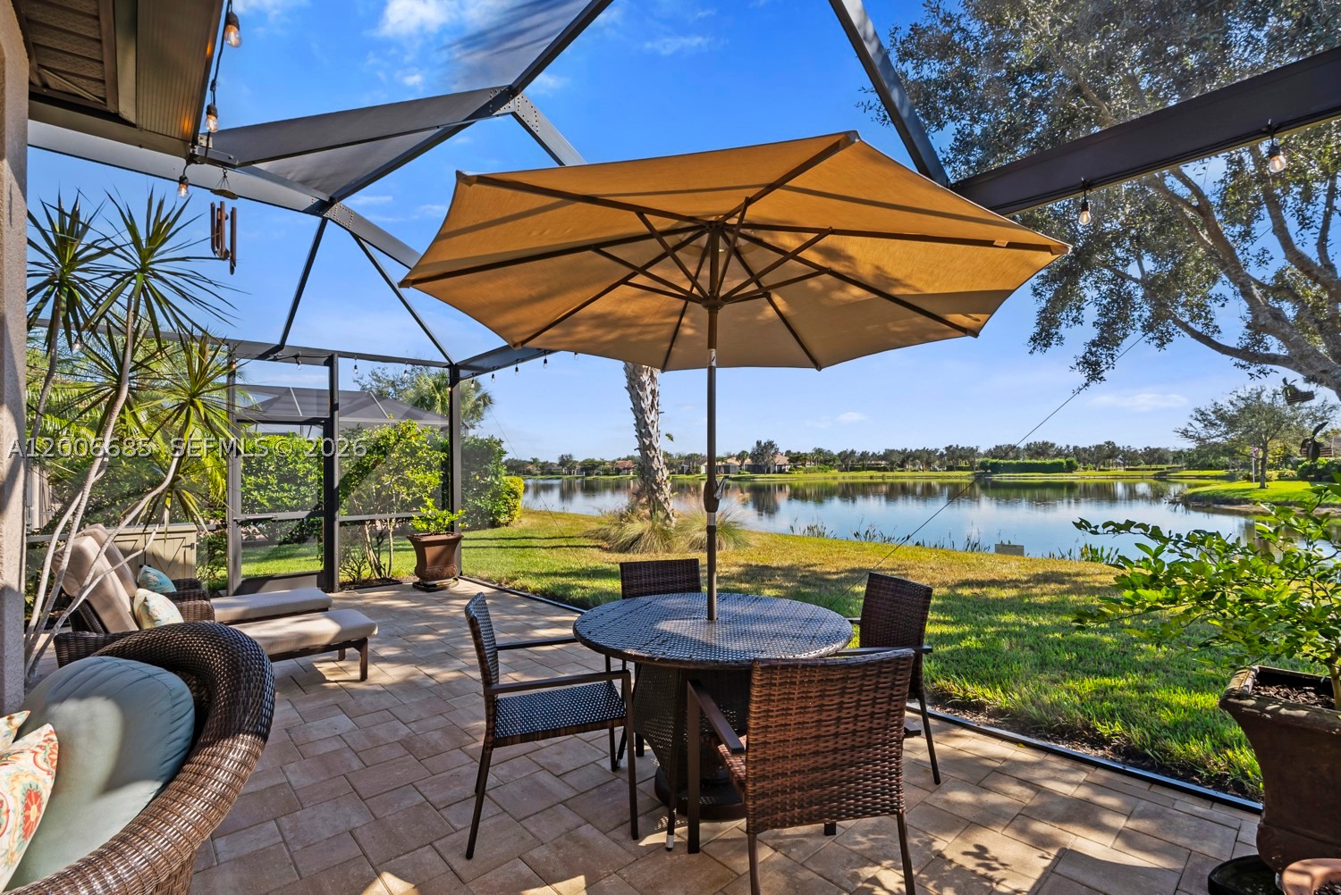 Rare 2-Story Abbeyville with Stunning LAKE VIEW! Don’t miss this hard-to-find 2-story Abbeyville in the 55+ Del Webb Naples community - offering a premium large lakefront lot and exceptional upgrades! This 3-BEDROOM + LOFT, 3-bath home provides the ideal layout for hosting visitors, multigenerational living, or creating the perfect hobby or flex space. The PRIMARY SUITE is located on the first floor and features a shower and soaking tub, dual sinks and walk-in closet. The upstairs LOFT features a living area, a full bathroom, bedroom and ample room for guests or creative pursuits. You'll find upgrades throughout, including tile on the diagonal, plantation shutters & blinds, and custom interior paint. The kitchen is equipped with a NEW BOSCH DISHWASHER (installed 2025), and the home is complemented by NEWER AC SYSTEM (2023) for efficient cooling. Step outside to your extended panoramic-screen lanai overlooking serene water views. Relax year-round in your private hot tub. This home is built for comfort and peace of mind with ACCORDION HURRICANE SHUTTERS, freshly painted exterior, and a front screened porch. The GARAGE is a standout feature with custom flooring, a quiet garage door system (installed 2025), and two overhead storage racks—providing excellent organization and functionality. In Del Webb Naples, you’ll enjoy WORLD-CLASS AMENITIES that rival luxury resorts