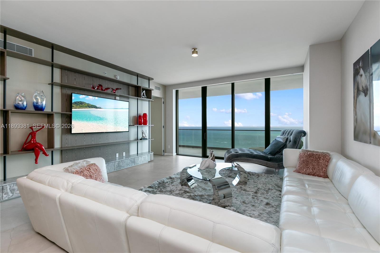 Experience the pinnacle of luxury in this 4 bedroom 5.5 bath plus Den Armani Casa masterpiece offered fully furnished with custom finishes on the 34th floor in the most favored 02 Line. This impeccably immaculate and professionally decorated flow-through residence with custom millwork and quality finished designer closets offers the ultimate in luxury. Breathtaking intracoastal and ocean views from an expansive balcony and city skyline views from the second equally expansive private balcony.  Elegant floor-to-ceiling glass windows and a private high-speed elevator provide luxury and convenience. The gourmet kitchen boasts custom European cabinetry with an island, Sub-Zero refrigerator, Wolf oven, wine cooler; all state-of-the-art appliances. Enjoy an amenity-rich lifestyle with over 35,000 sq ft of premier features: private oceanfront restaurant, bar, cigar room, game room, fitness center, spa, heated pool, jacuzzi, dog park, beach service, cinema & 24-hour valet/concierge & security. Interior SF 3176 SF Balconies 886 SF Total SF 4062, per Developer Floor Plan.