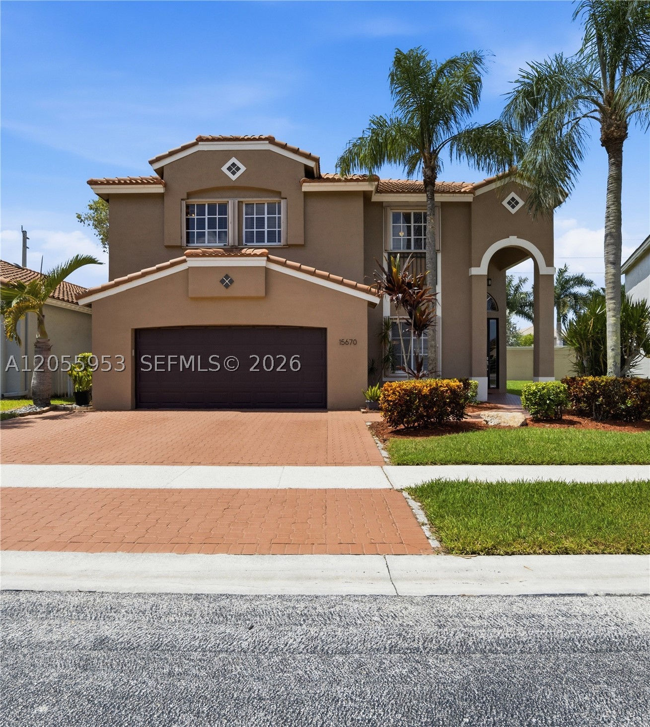 THIS WONDERFUL GRAND PALMS GOLF AND COUNTRY CLUB HOME AND RARELY AVAILABLE GRAND BAY MODEL FEATURES  4 BEDROOMS  AND 2.5 BATHS. THE HOME FEATURES A FIRST FLOOR PRIMARY SUITE WITH ADDITIONAL 3 BEDROOMS UPSTAIRS OPEN TO  A LARGE LOFT AREA.  EXPANSIVE 2 STORY CEILINGS THROUGHOUT THE HOME. NEW ROOF 2021, NEW A/C(5 TON) 2022. REMODELED BATHROOMS AND KITCHEN. A BONUS PERMITTED GARAGE CONVERSION ADDS 360SQ FT OF LIVING AREA, WITH AN OPERATIONAL IMPACT GARAGE DOOR AND STORAGE AREA. OUTSIDE FEATURES INCLUDE AN EXPANDED 3 CAR DRIVEWAY, EXTENDED LARGE PATIO IN THE FENCED BACK YARD WITH PLENTY OF ROOM FOR A POOL AND COMPLETE HURRICANE PROTECTION. GRAND PALMS/GROVE ESTATES HOA INCLUDES COMPLETE LAWN CARE, SPRINKLERS(W/ WATER), CABLE,INTERNET, WIFI, MAILBOXES,PALM TREE TRIMMING, MANNED GUARD GATE, ROVING PATROL,SECURITY ALARM WITH ADT MONITORING AND A NEW CONVIENENT BACK GATE, FOR MAINTENCE FREE LIVING IN THIS GUARD GATED GOLF COMMUNITY.