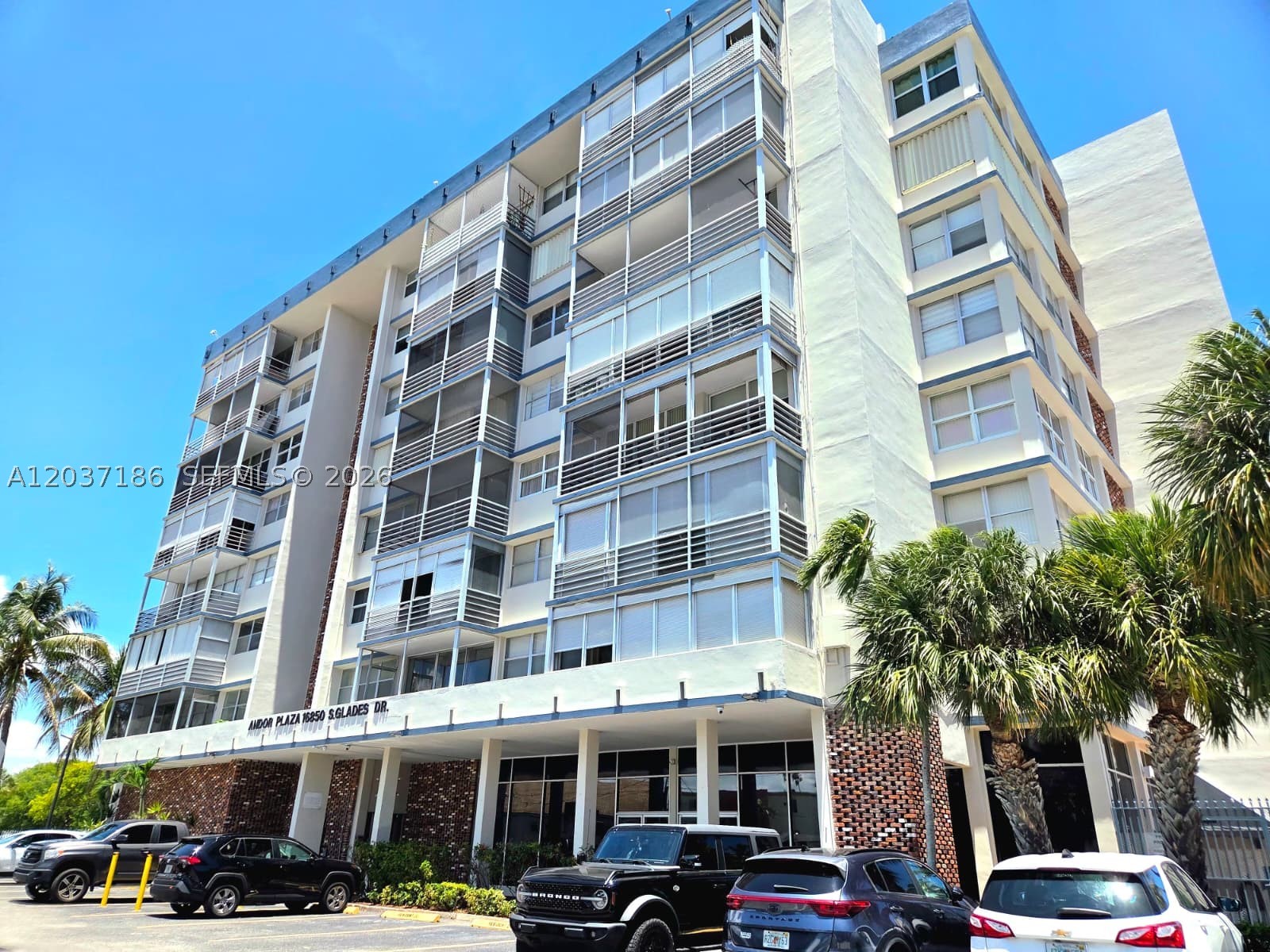 16850 S. Glades Drive 2K is a beautifully renovated condominium located in the heart of North Miami Beach. This move-in-ready 2-bedroom, 2-bath residence offers approximately 970 square feet of thoughtfully designed living space, blending modern upgrades with comfort and convenience. Spacious open layout is enhanced by elegant finishes, abundant natural light, and an oversized screened balcony perfect for relaxing or entertaining. The updated kitchen features contemporary cabinetry, granite countertops, stainless steel appliances, and ample storage, creating a stylish and functional space for everyday living. Both bathrooms have been tastefully upgraded, while the unit also boasts a newer air conditioning system, updated lighting fixtures, fresh paint, modern interior doors, and attractive flooring throughout. Located within the well-maintained Andor Plaza community, residents enjoy a variety of amenities including a swimming pool, fitness area, billiards room, clubhouse, elevators, and community recreation spaces. The building is situated along a tranquil canal, providing a peaceful setting while remaining close to everything South Florida has to offer. Conveniently located just minutes from major highways, shopping centers, dining, & entertainment, this property offers exceptional accessibility and lifestyle appeal. Unit 2K presents an outstanding opportunity to own a beautifully updated home in one of North Miami Beach's most desirable and centrally located communities.