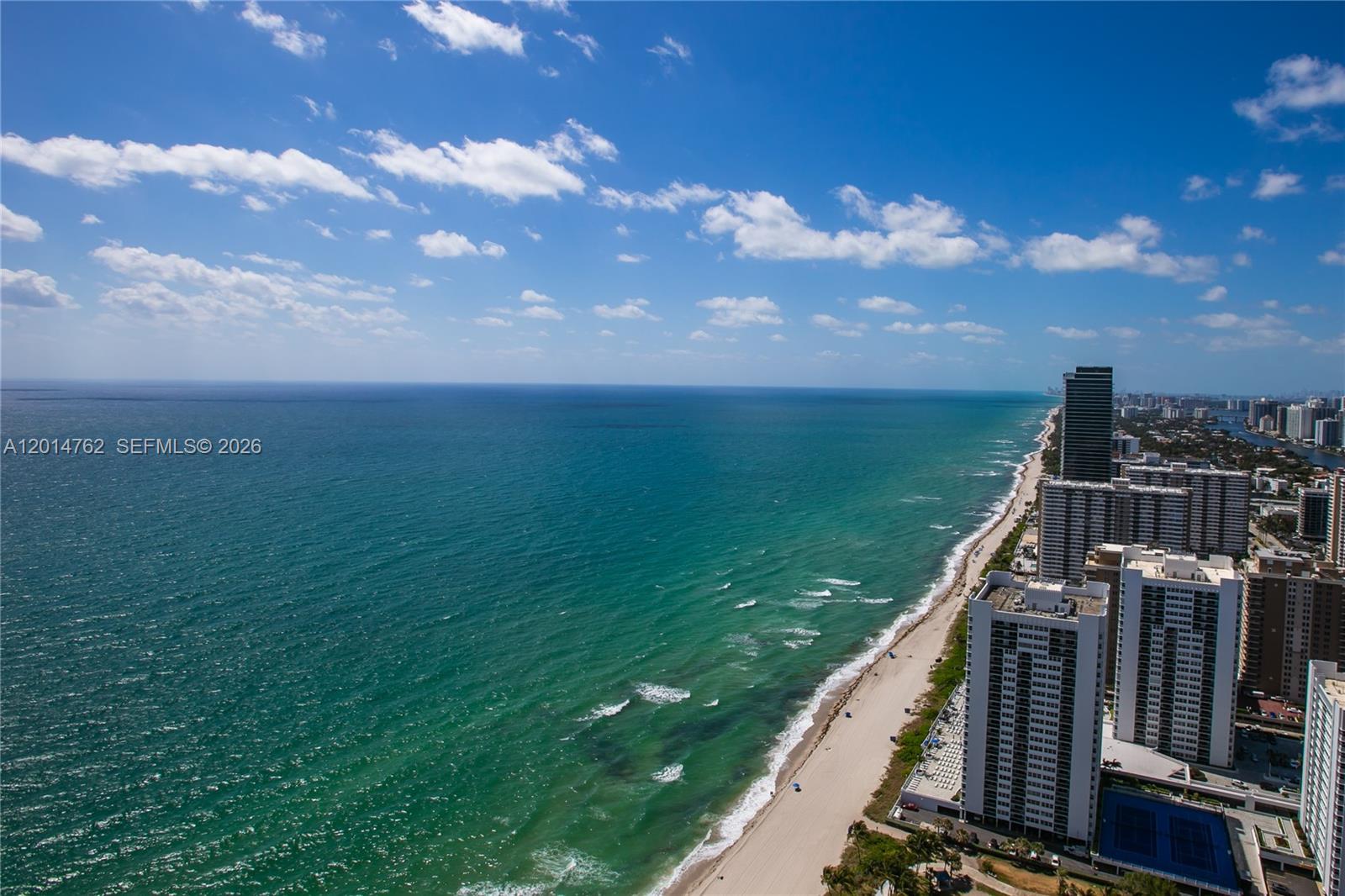Breathtaking ocean and Intracoastal views await from this 45th-floor residence at the prestigious Beach Club. This immaculate, bright, and spacious 2-bedroom + den, 3-bath home features desirable southeast exposures, filling the unit with natural light and showcasing spectacular water views from every angle. The residence offers limestone floors throughout, a luxurious primary suite with a Jacuzzi tub, and a sleek European-style kitchen with granite countertops and premium KitchenAid appliances. Enjoy resort style living with direct beach access, including umbrella and sunbed service. The Beach Club offers world-class amenities such as concierge service, valet parking, 6 infinity-edge pools, on-site bar and restaurant service, and a state-of-the-art 50,000 sq. ft. oceanfront spa and fitness center. Ideally located near Gulfstream Park and the Hollywood Beach Broadwalk, and just minutes from Aventura, Bal Harbour, South Beach, and Las Olas Boulevard. Excellent investment opportunity. The unit can be rented up to 12 times per year, long or short term.
