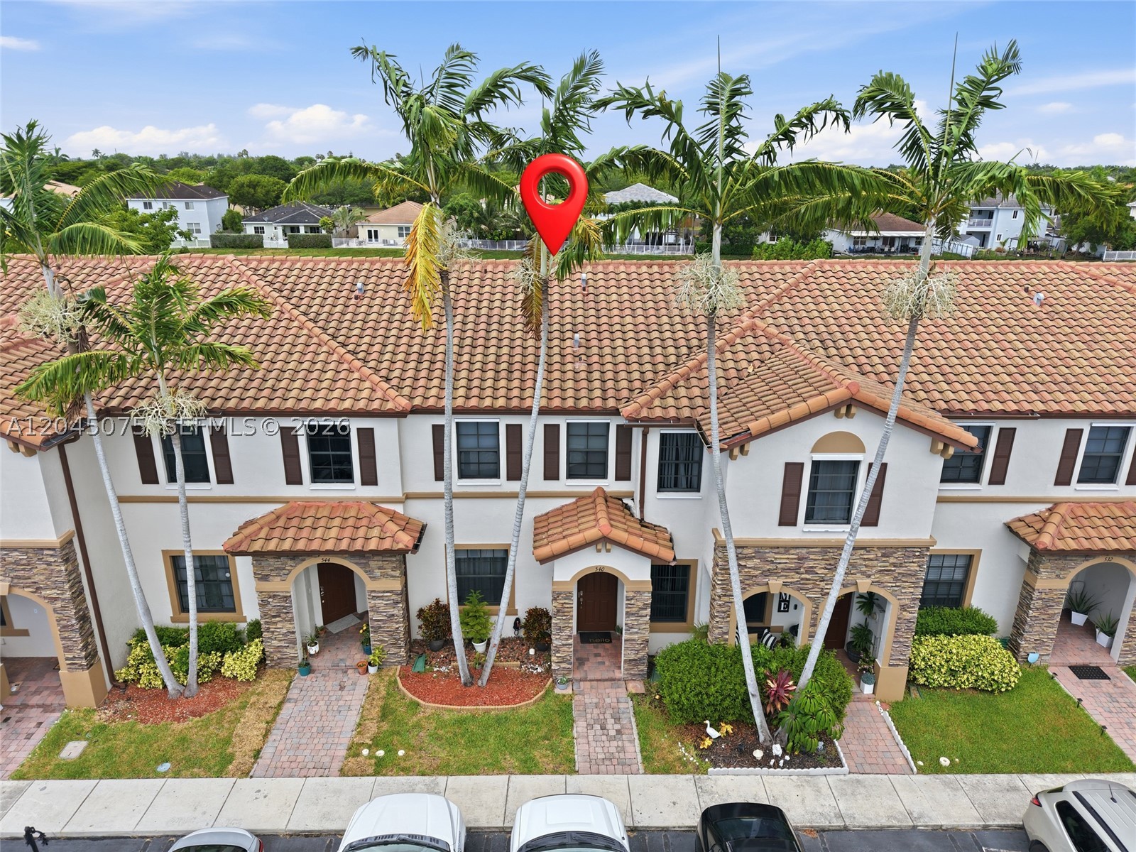 Beautiful lakefront home in the gated community of Martinique at Oasis. The interior features a thoughtfully designed floor plan with bright, open living spaces, tile flooring throughout the main level, and a modern kitchen with ample cabinetry, generous counter space, and a breakfast bar overlooking the dining and living areas. Upstairs, the spacious primary suite boasts tray ceilings, a walk-in closet, and an en-suite bath. Enjoy peaceful lake views from the covered patio, perfect for relaxing or entertaining outdoors. Residents enjoy access to resort-style amenities, including a clubhouse, expansive pool, fitness center, and beautifully maintained common areas. Conveniently located near shopping, dining, schools, parks, major highways, and the Florida Turnpike, this move-in-ready home combines comfort, convenience, and lifestyle.