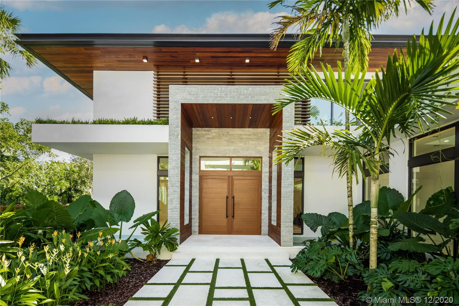 Introducing a luxury, personal resort in a premium location by a leading residential developer, Location Development. Designed by César Molina. This truly exceptional, high-quality residence embodies the Florida lifestyle, inside and out. The spacious floor plan highlights an indoor/outdoor lifestyle with large terraces, outdoor entertainment areas, and multiple bedrooms, featuring a master apartment and separate guest suite. A suite of thoughtfully-planned features and amenities that will provide incredible spaces to relax, entertain and experience the best that life has to offer. Complete home automation, wine room, media room, dedicated study, outdoor kitchen and fire pit, a lap pool, gym, hammam spa w/ steam room & hydrotherapy program. Garage fits up to 8 cars for an avid collector.