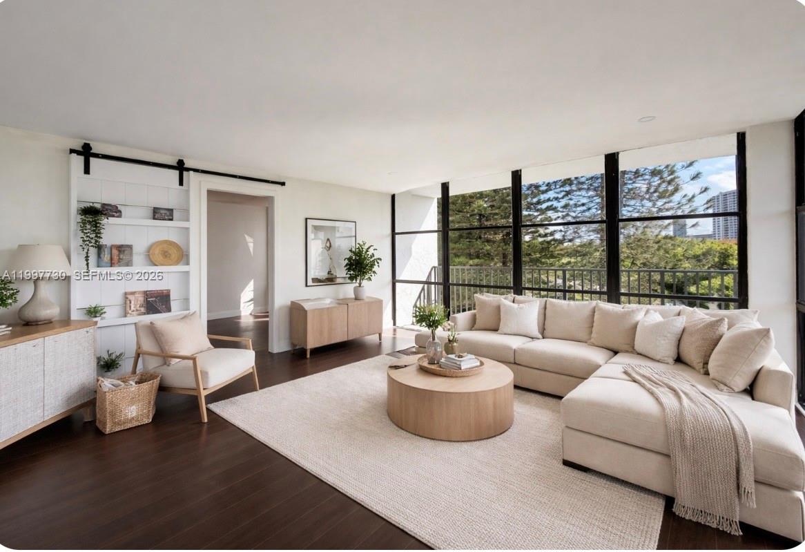 BEST DEAL IN THE BUILDING!! Welcome to this premium 1,455 Sq ft at Oceanview Park, offering 2 beds + Den ( convert to a 3rd bedroom) 2 bath CORNER UNIT with wrap around balcony overlooking the city! THE LARGEST UNIT IN COMPLEX with beautiful views from every room. Features Include: Floor to ceiling windows, Large Modern open concept Living room, Dining room & Renovated kitchen with Quartz countertops. Beautifully maintained full-service building with 24-hour doorman. Amenities Include: Heated pool, jacuzzi, tennis, sauna, gym, BBQ area with picnic tables, library & Club room. Prime Location in Three Islands and in the heart of it all and only a mile to the beach, Close to Luxury Restaurant's, Gulf Stream Park Casino & The Aventura Mall !!