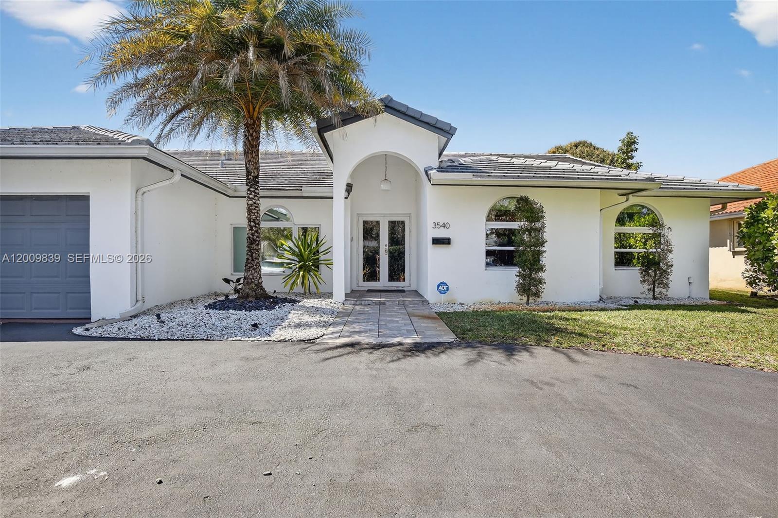 Step into a beautifully remodeled Hollywood estate where style meets comfort, no detail overlooked and no expense spared. This stunning home welcomes you with an open concept layout, vaulted high ceilings, and expansive living and dining spaces perfect for both entertaining and everyday living. At the heart of the home, the gourmet kitchen shines with quartz countertops, frameless cabinetry, and stainless steel appliances. Enjoy peace of mind with major upgrades already in place, including a 2019 roof, PVC plumbing, and high-impact windows and doors throughout. Elegant, modern finishes elevate every corner of this home. Step outside to your own private retreat, an inviting enclosed patio opens to a big back yard with brand new porcelain pool deck and turf throughout. perfect for relaxing or hosting under the Florida sun. A must see!