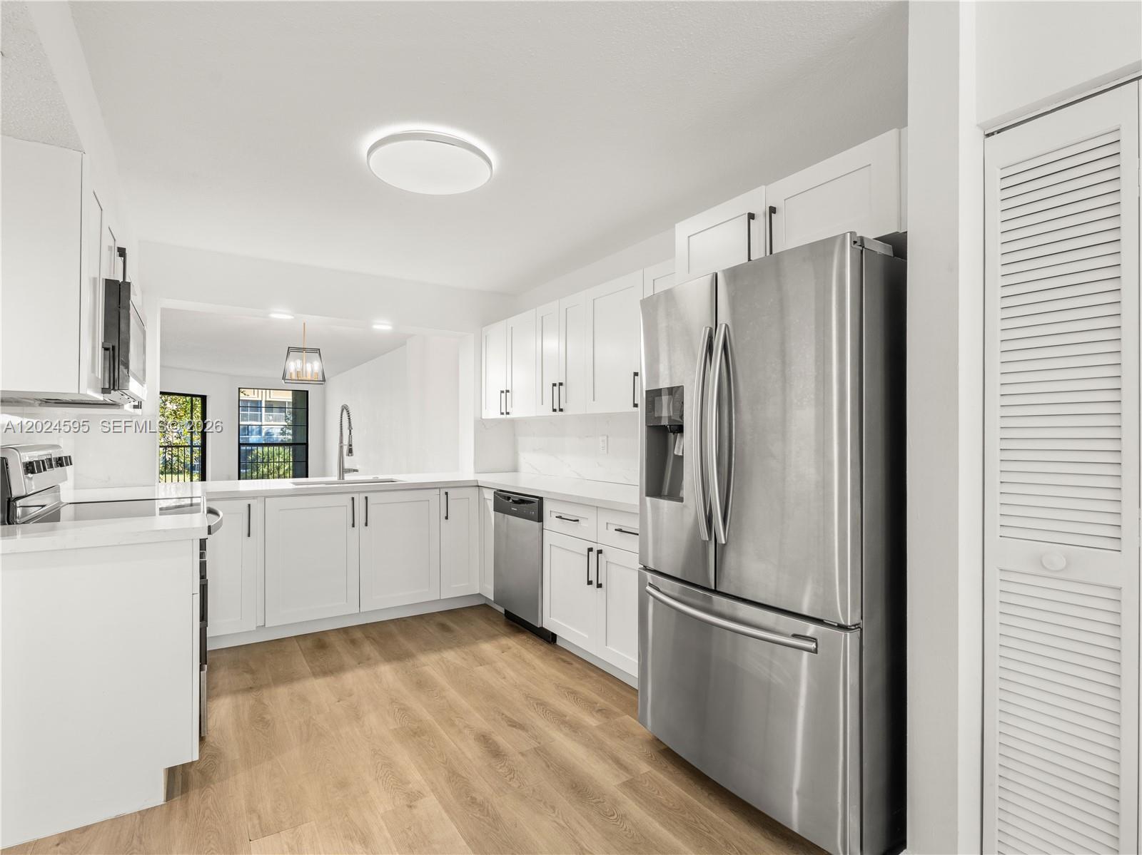 Beautifully maintained unit with impact windows at 7547 Fairfax Dr #210 in the heart of Tamarac. This bright and spacious residence features an open living area, a 2-year-old AC, a dining area, generous natural light, and a functional layout ideal for comfortable everyday living. The kitchen offers ample cabinet space, a newer washer & dishwasher, and flows seamlessly into the main living area. Spacious bedrooms with plenty of closet space and a well-appointed bathroom complete the interior. Enjoy peaceful views and a quiet community atmosphere, with convenient access to shopping, dining, parks, and major roadways. Well-kept community with amenities and low-maintenance living, perfect for primary residence or investment. Don’t miss this opportunity to own in a desirable Tamarac location.