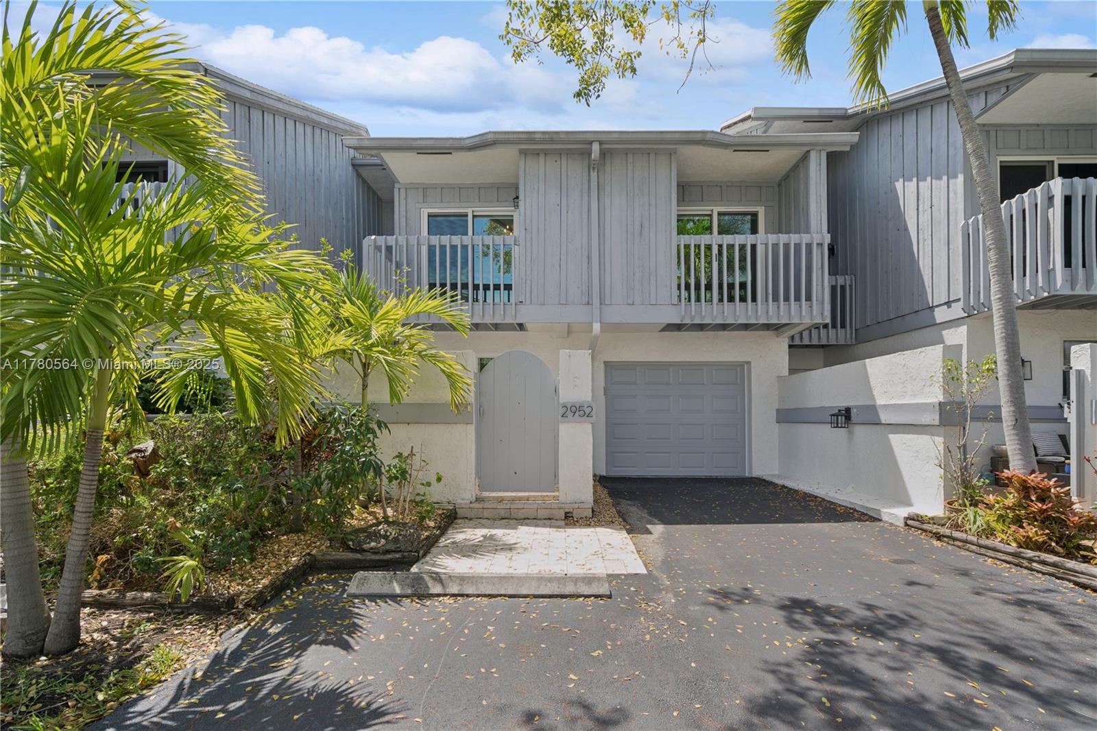 Motivated Seller! Spacious and renovated townhome ideally located in the beautiful Harbour Club community, minutes from the beach in Delray Beach. Volume ceilings and newly installed impact windows and doors (2023) throughout the entire property provide bright and spacious living areas within the 3 bedroom, 2 and half bath property. A large private front entry porch, generous patio/backyard area and upper level balconies offer multiple outdoor sitting and entertaining areas uncommonly found. Other features which make this property stand out include new AC (2022), newer flooring, renovated bathrooms, a new water osmosis system, newer washer/dryer and new garage motor/machinery board.