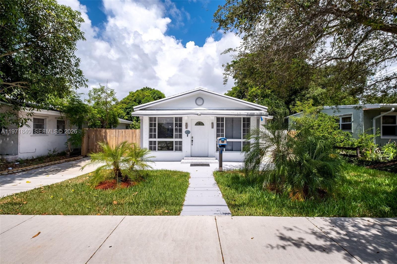Priced to sell! Welcome to one of Hallandale Beach's best-valued single-family homes — fully updated, move-in ready, and packed with income potential. New Roof (2022), New AC (2022), upgraded kitchen, renovated bathrooms, and vinyl flooring throughout. The expansive primary suite features a private ensuite, walk-in closet, and direct backyard access — ideal for multi-generational living or a turnkey Airbnb setup. Two additional bedrooms share a stylish Jack-and-Jill bath. Zero deferred maintenance: every major system updated and move-in ready. Oversized driveway fits multiple vehicles, boat, or RV — no HOA restrictions. Spacious tropical backyard with mature mango tree and room for a pool. Strong rental demand in the area with full flexibility for investors and end users alike. Located just 1 mile from Gulfstream Park & Casino, 2 miles to the beach and Aventura Mall, blocks from US-1 and major highways. Whether you're seeking a primary residence, vacation retreat, or income-producing asset — this home delivers. Enjoy effortless access to top dining, shopping, Publix, Walgreens, and more. Currently tenant-occupied with lease through July 2026 — immediate rental income for investors, with possession available this summer for end users. Call today!