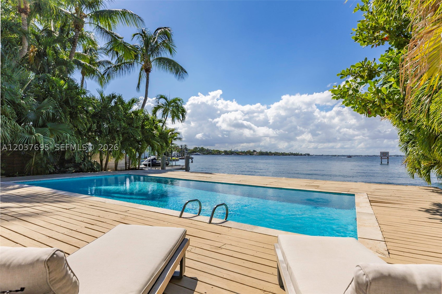 Nestled on the highly coveted and exclusive Hawthorne Avenue, this Miami Beach waterfront masterpiece invites you to live a life dictated by the tides and golden hour. Offering 2,700–3,000 square feet of impeccably designed space, the four-bedroom layout accommodates both effortless entertaining and quiet relaxation. The heart of the home features expansive living areas and a contemporary kitchen, all oriented toward the majestic Miami sunsets. Outside, the property transforms into a private club, boasting a sparkling pool, a sprawling 9,000-square-foot lot, and direct open-bay frontage that makes launching a boat or watching the horizon a daily ritual. Positioned mere minutes from the refined culture of Bal Harbour and the relaxed elegance of North Beach, 8220 Hawthorne Avenue stands as a rare, serene sanctuary in the heart of Miami Beach.