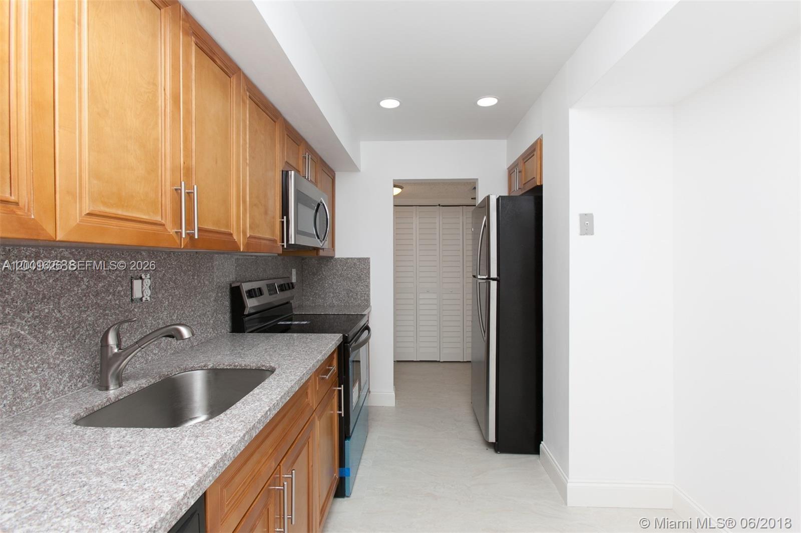 Welcome to your new home in the HOPA community of Environ at Lauderhill! This spacious 2 BR, 2 BT condo offers a perfect blend of comfort and style. Step into a fully renovated kitchen, complete with elegant wooden cabinetry and sleek stainless steel appliance. The living and dining areas feature tile flooring, providing a modern look and easy maintenance, while the bedrooms boast warm, inviting wooden floors. Enjoy your morning coffee or unwind after a long day on the private patio, which overlooks a lush, green golf course. The serene view and peaceful surroundings make this patio a perfect spot for relaxation. Perfect for First time home buyer or Investor.