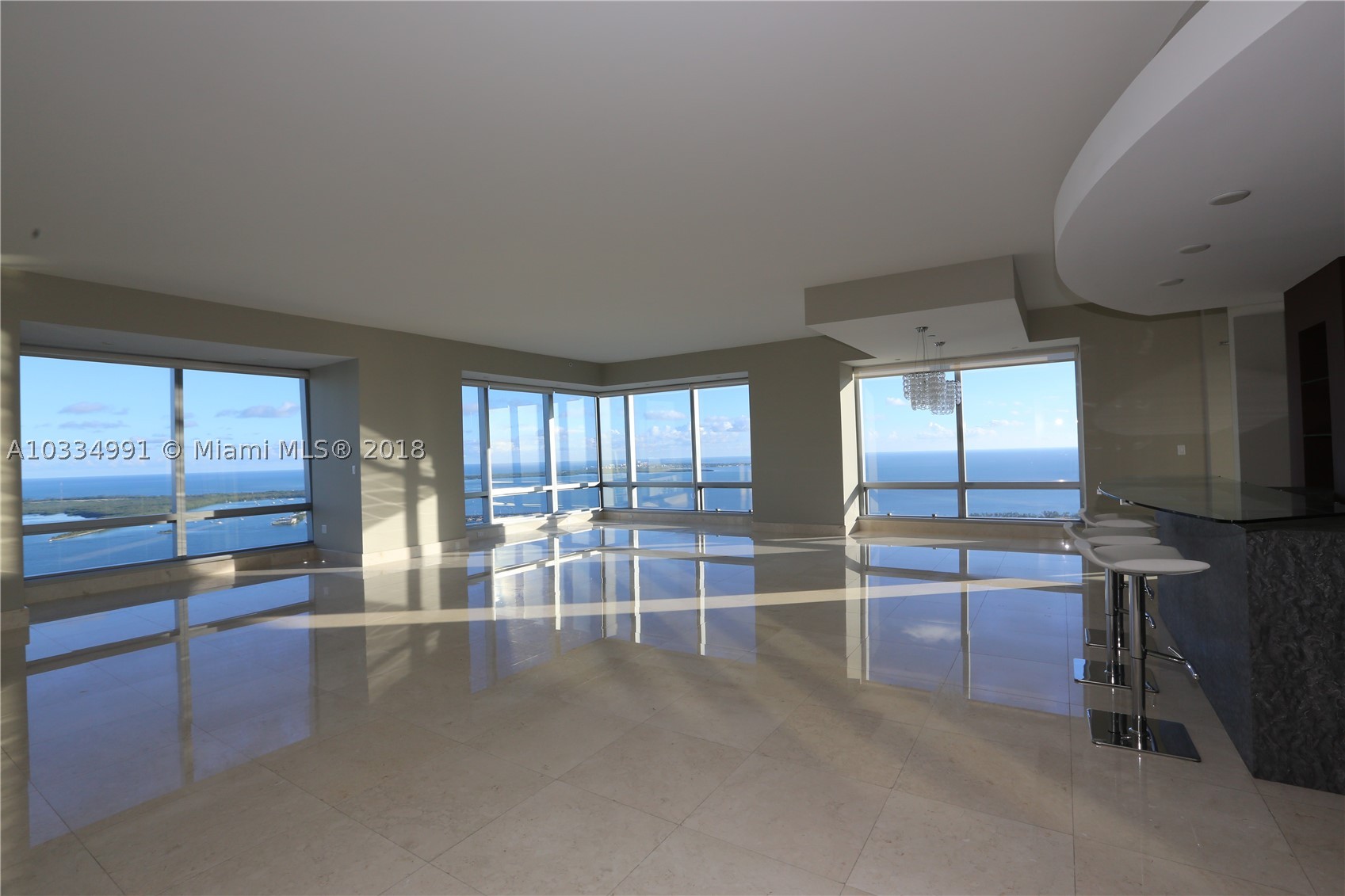 Unobstructed panoramic ocean and bay views from Key Biscayne to Miami Beach! Best line in the building! Beautifully finished SE Corner unit with entry foyer leading to an open floor plan with floor to ceiling windows offering spectacular water views. Marble floors throughout, custom eat-in kitchen with Viking appliances, double ovens and custom bar in living room. Large master suite with Jacuzzi, separate shower with ocean views and walk-in closets. All en-suite bedrooms with double vanities. Two Equinox gym memberships included. 5-star amenities. Also available for lease for $15,000.00 per month.