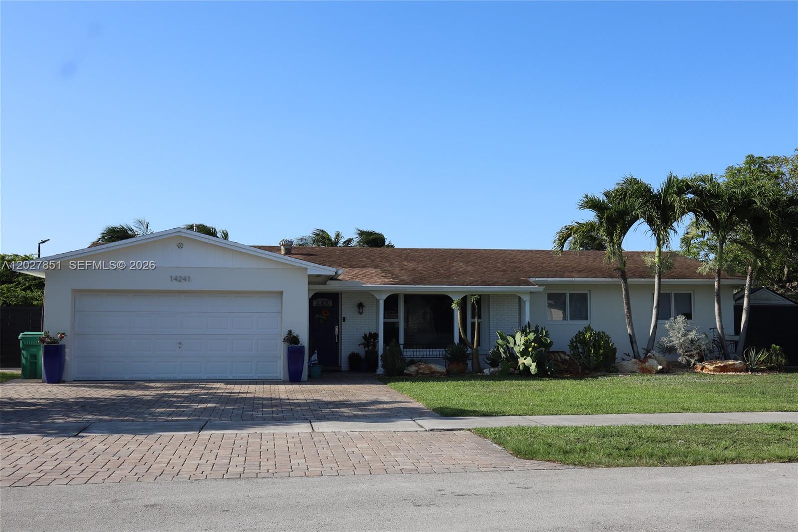 Tastefully remodeled 4-bedroom, 2-bathroom home featuring beautiful flooring throughout, updated bathrooms, a modern kitchen with granite countertops, and numerous upgrades throughout. Enjoy natural gas service with a gas range and dryer, a professionally rehabilitated plumbing system utilizing pipe-lining technology, a privately owned water softener, and an epoxy-coated garage floor. All doors and windows are impact-rated for added safety, energy efficiency, and peace of mind. The spacious backyard offers beautiful lake views and the perfect setting for relaxing or entertaining. Move-in ready and meticulously maintained.