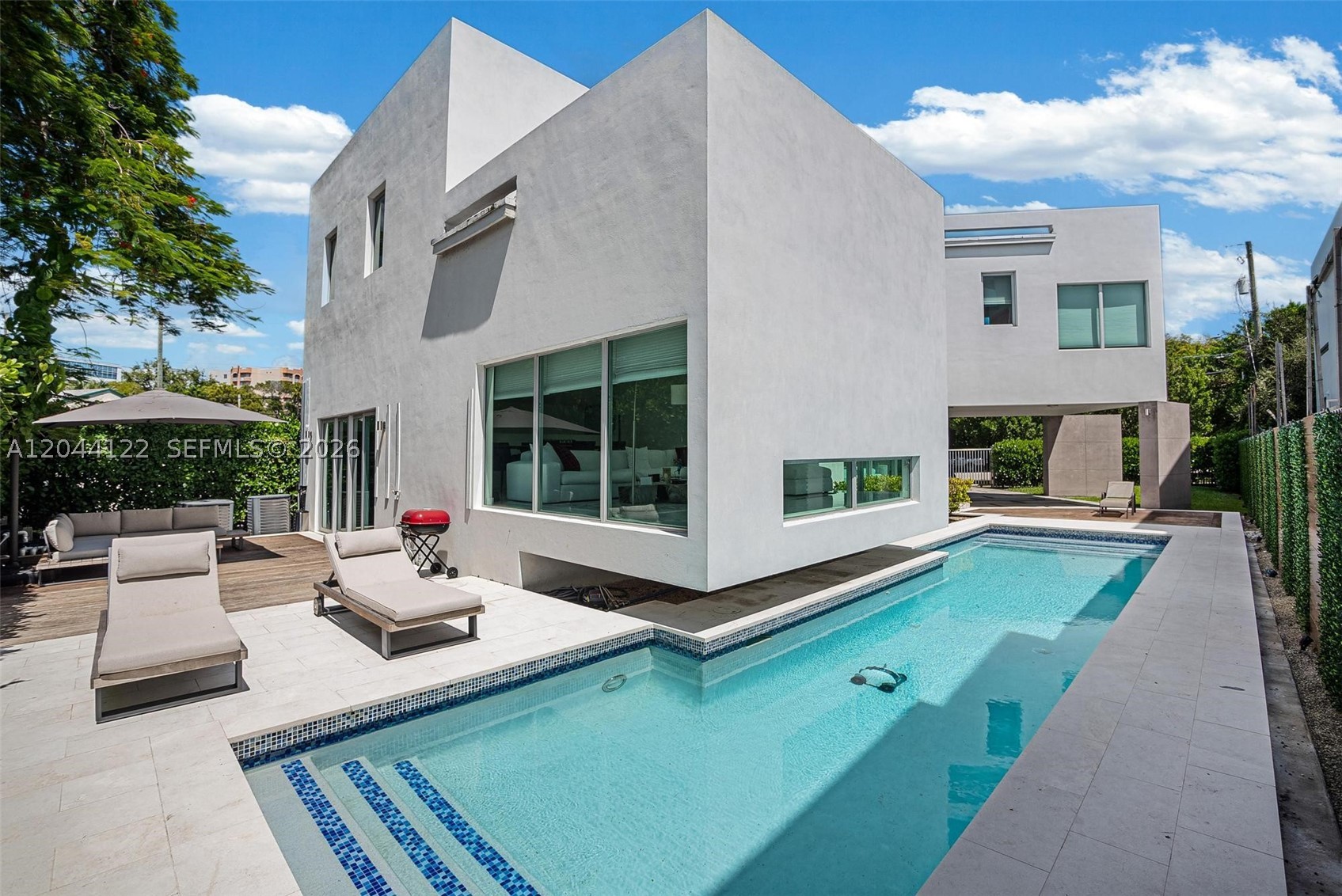 Rent this exquisite 2020-built single-family home in The Roads, offering a perfect blend of modern luxury and sustainability. This stunning property features 4 bedrooms and 3 baths, with 3 bedrooms and 2 baths located upstairs, and a versatile den with a full bath on the main level that can serve as a 4th bedroom or guest suite. The home boasts an open-concept layout with soaring double-height ceilings, allowing natural light to flood the space. The spacious backyard offers a beautiful pool and breathtaking panoramic views. The expansive master suite includes a jacuzzi and walk-in closets. Ideally located just few minutes from Brickell, Coconut Grove, and Key Biscayne, this home also features 37 solar panels for outstanding energy efficiency.