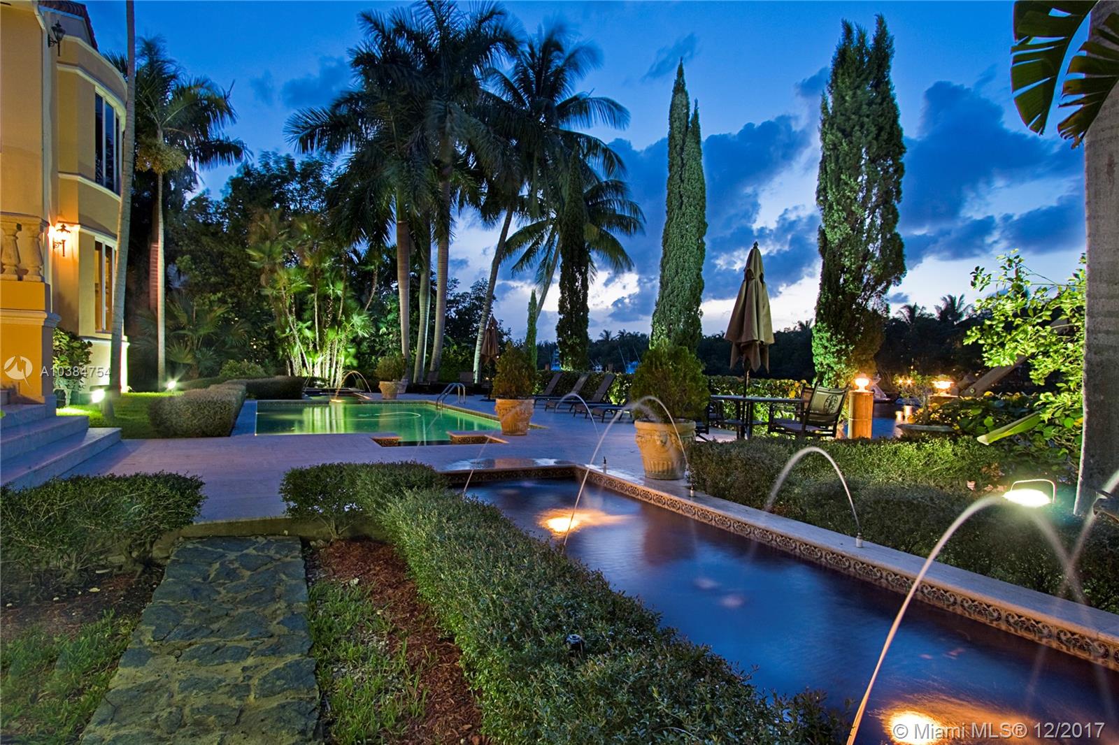Best wide water no bridge to Bay on spectacular 24,468 Sf lot, protected dock, wide canal, 110 ft dock, gated motor court. Leaded glass, double doors, open grand foyer. Living room with 24 foot ceilings. Wall of french doors to terrace. Spacious chef kitchen with fabulous view. Master suite with opulent bath plus view of Downtown from floor to ceiling glass. Fine millwork, stained glass, rich marble, recreation room + wine room. Resort pool area with reflection pools plus spa and summer kitchen pavilion. 2 offices, guest quarters. 2/1 staff quarters. Great property to add value! Best waterfront, no bridges to Bay value.