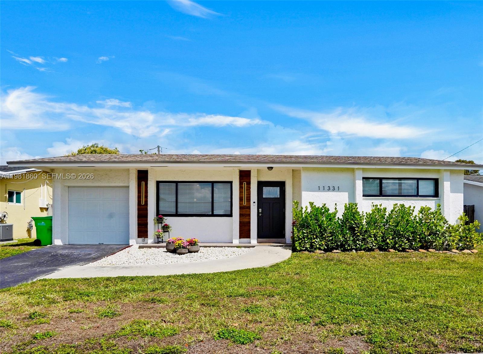 Perfect starter home! Tax roll reflects a  2-bedroom, but the home lives like a 3-bedroom with a versatile den currently used as an additional bedroom, complete with private sliding doors and a built-in-closet. This neighborhood has No HOA! Step into this warm and inviting South Florida home where comfort meets thoughtful upgrades. Designed with cozy yet elevated feel, this home features a modern kitchen, updated flooring, & an upgraded electrical panel completed in 2021, along with a new A/C & beautifully remodeled bathroom in 2023. The roof was replaced in 2018, offering added peace of mind.  Additional highlights include a tankless water heater, high-impact windows and front door and shutters for the back windows.  Bright Florida room adds more flexibility perfect for a third bedroom or home office while the converted garage offers a utility room featuring additional room under a/c that is currently used as a recording studio/game room, but can be used to fit your lifestyle needs. The expansive outdoor space invites endless possibilities-whether you envision adding a pool or expanding the home.  Ideally located near the athletic complex & Welleby Park and just a short drive to Sawgrass Mills Mall for premier shopping & dinning. 
This home offers comfort, versatility and endless potential. Perfect for homeowners and investors alike.