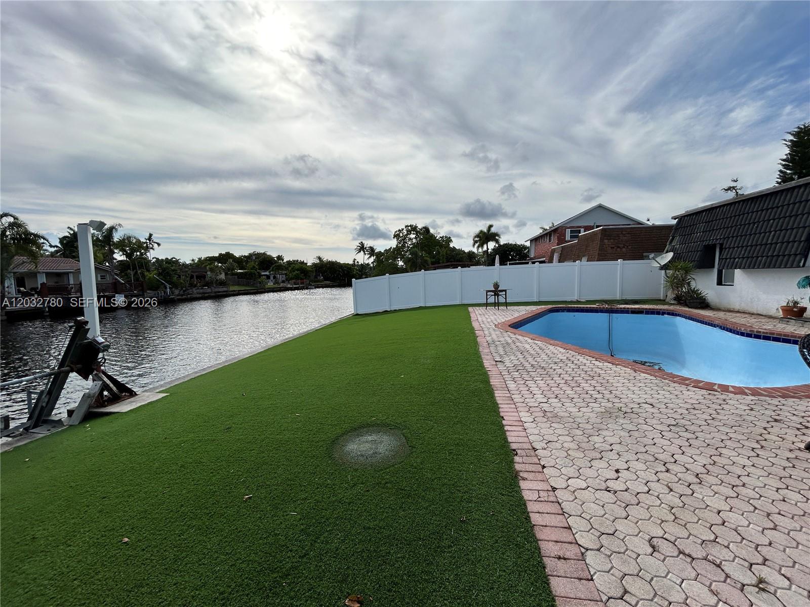 Property is in need a full rehab. Has amazing potential. 55+feet water frontage on the New River plus a large pool. There is access all the way to the ocean, with fixed bridges along the way. Bring your highest and best offer!