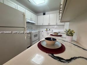 THIS BEAUTIFULLY RENOVATED PROPERTY IS READY FOR YOU, FEATURING A MODERN STYLE AND HIGH-QUALITY DETAILS INCLUDING DURABLE AND ELEGANT LAMINATE FLOORS, A COMPLETELY RENOVATED KITCHEN PERFECT FOR COOKING ENTHUSIASTS, AND FRESH PAINT THROUGHOUT SO YOU CAN MOVE IN WITHOUT ANY EXTRA WORK. ENJOY A STUNNING VIEW OF THE LAKE AND LUSH GREEN AREAS WHILE LIVING IN A MODERN AND COMFORTABLE HOME. CENTURY VILLAGE IS A PEACEFUL AND SECURE 55+ COMMUNITY OFFERING RESORT-STYLE AMENITIES SUCH AS POOLS, CLUBHOUSE, GYM, TRANSPORTATION, RECREATIONAL AREAS, AND MORE. DON’T MISS THIS INCREDIBLE OPPORTUNITY TO LIVE IN THE PERFECT PLACE!