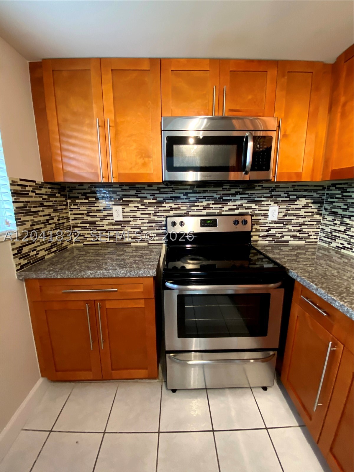 Centrally located near Doral, MIA airport, FIU, Dolphin Mall, Expressways 826, 836 and Turnpike. Beautiful and spacious on 1st floor, clean and remodeled unit, Crown Moldings, Closet Organizer, wood Kitchen Cabinets, Granite top and Stainless Steel Appliances,. Full front load Washer & Dryer inside the unit. Walking access to Shopping Center with Walmart, LA Fitness and more.