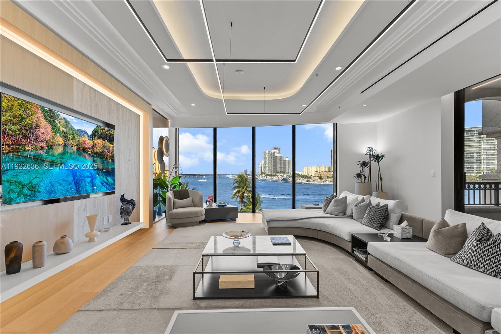 An exceptional flow-through residence at Palazzo Della Luna, Fisher Island’s newest and most exclusive full-service building. Thoughtfully designed and exquisitely furnished by INDELUX Italia, this turnkey home offers 3,620 SF of elegantly refined interiors+778 SF of deep terraces, totaling 4,398 SF of seamlessly connected living space. A private elevator entry unveils a grand, light-filled great room that frames a captivating panorama sparkling South Beach, the tranquil Miami Beach Marina, the iconic downtown Miami skyline, and a front-row view of Government Cut, where cruise ships glide past in an unforgettable procession. The residence features 3 bedrooms and 3.5 baths, showcasing wide-plank European oak flooring, a custom BOFFI kitchen appointed with Miele and Sub-Zero appliances, wine refrigeration, and BOFFI bathrooms finished in Italian stone with Duravit and Dornbracht fixtures. Custom millwork, integrated built-ins, and a warm neutral palette enrich the home’s sophisticated contemporary aesthetic. Enhancing everyday comfort, the residence includes two discreetly integrated water filtration systems a whole-unit purifier elevating the quality of all incoming water, and a reverse osmosis system at the kitchen sink providing pristine drinking water. Offered fully furnished, this home allows for an effortless and immediate move-in experience.